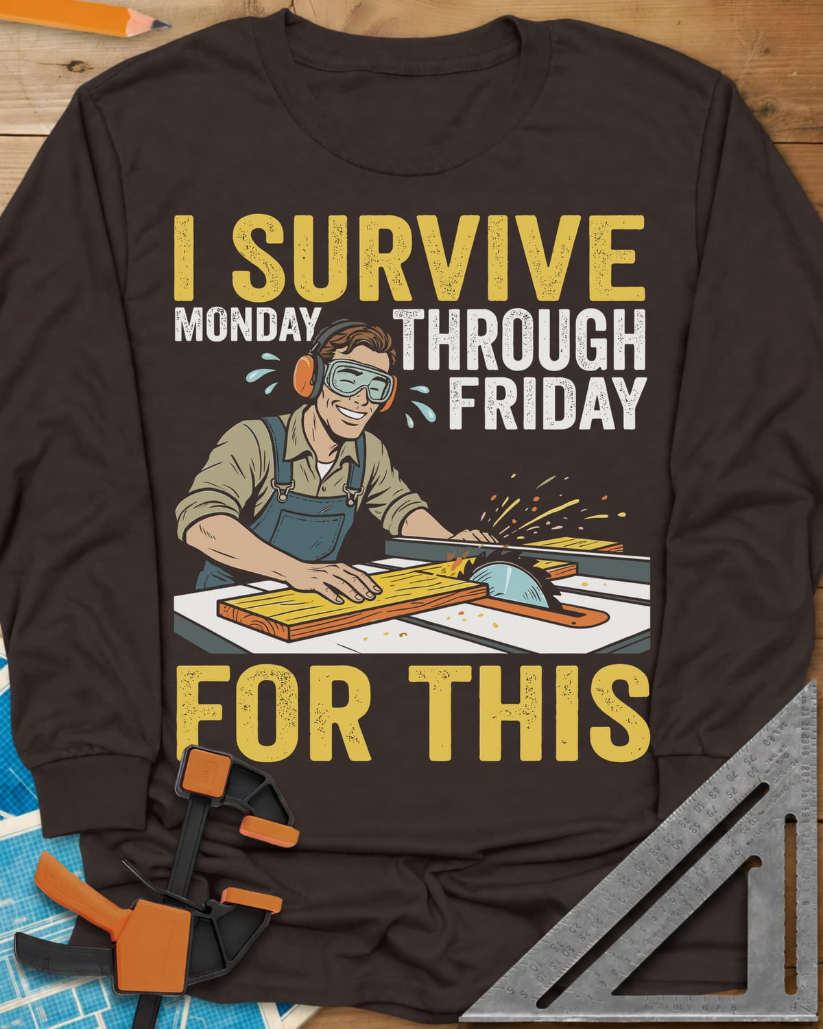 Weekend Reward long sleeve shirt in Dark Chocolate, a smiling woodworker in goggles pushing a board through a table saw