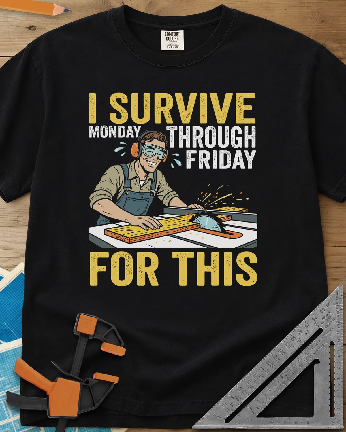Weekend Reward heavyweight tee in Black, a smiling woodworker in goggles pushing a board through a table saw