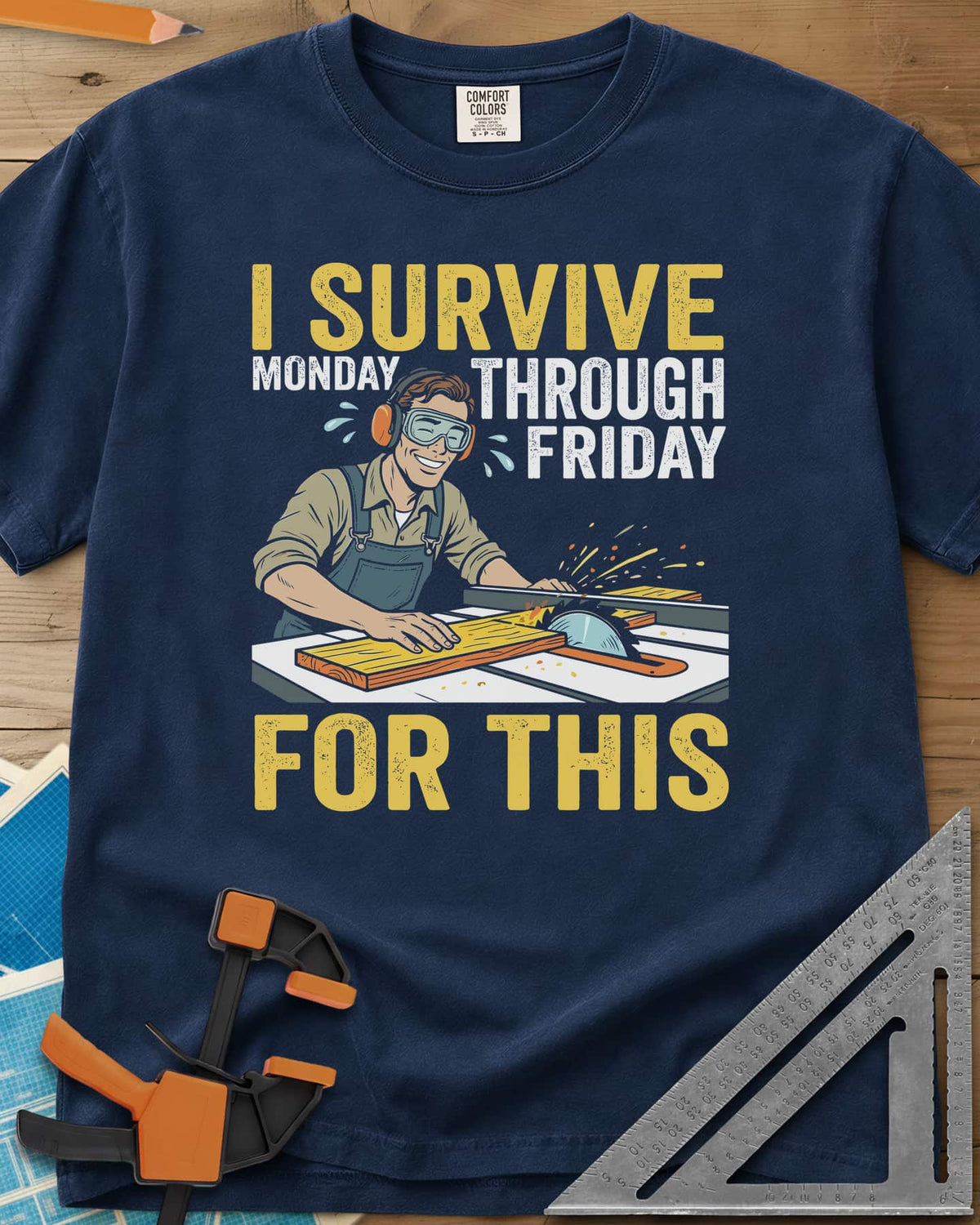 Weekend Reward heavyweight tee in Navy, a smiling woodworker in goggles pushing a board through a table saw
