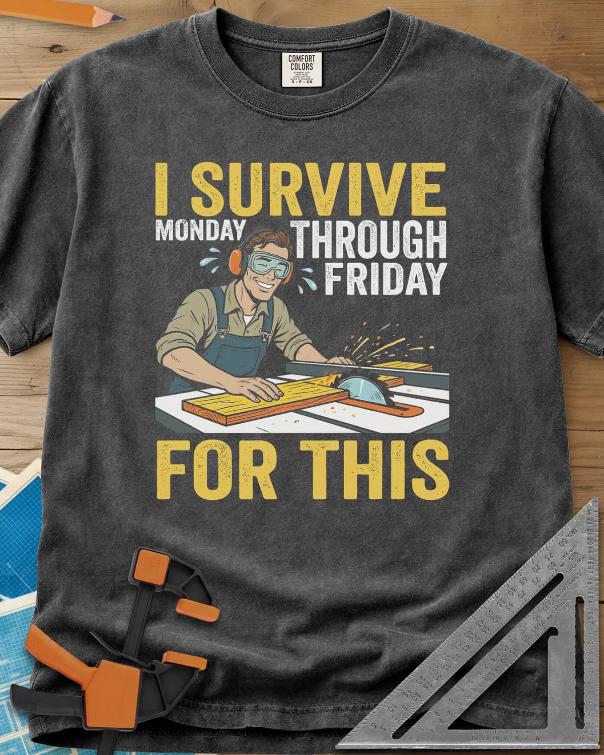 Weekend Reward heavyweight tee in Pepper, a smiling woodworker in goggles pushing a board through a table saw