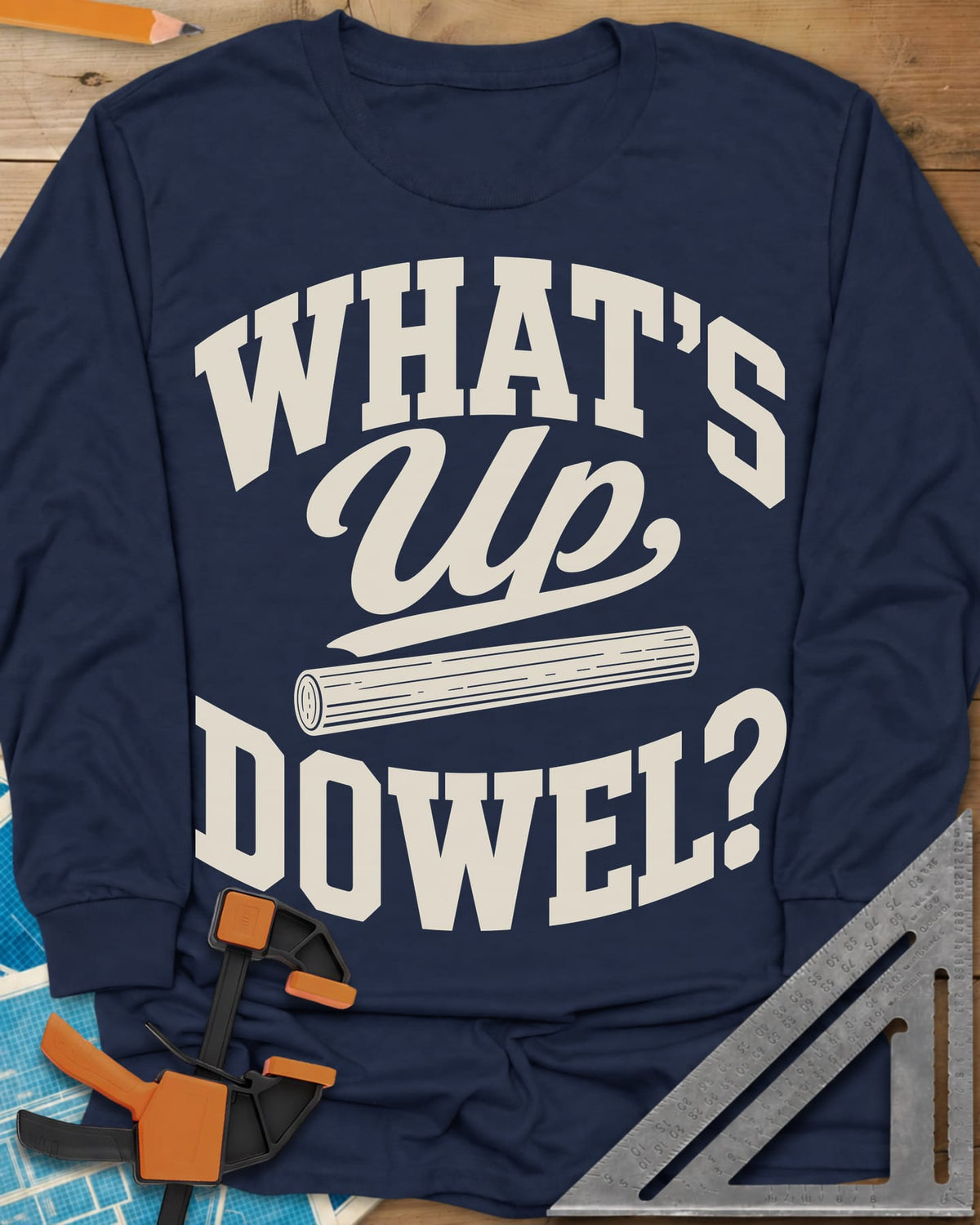 What'S Up Dowel long sleeve shirt in Navy, a wooden dowel under a script Up between slab-style words
