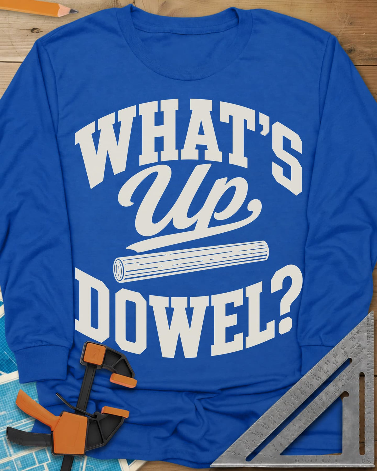 What'S Up Dowel long sleeve shirt in Royal, a wooden dowel under a script Up between slab-style words