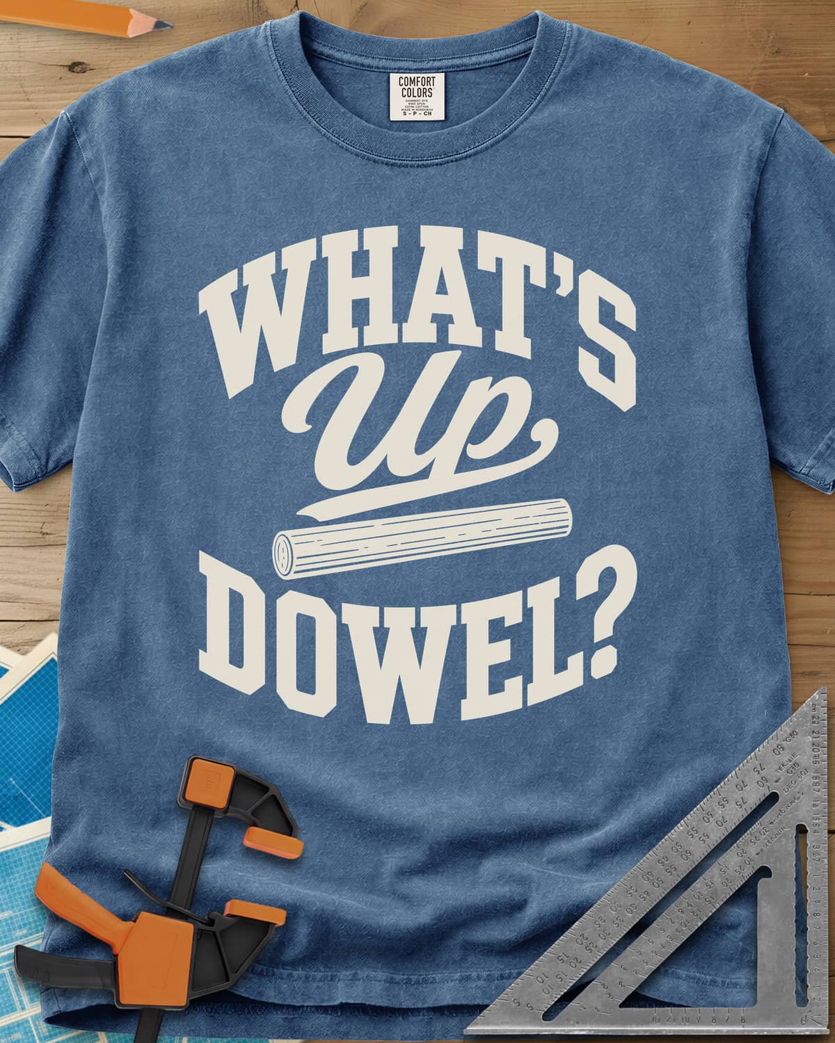 What'S Up Dowel heavyweight tee in Blue Jean, a wooden dowel under a script Up between slab-style words