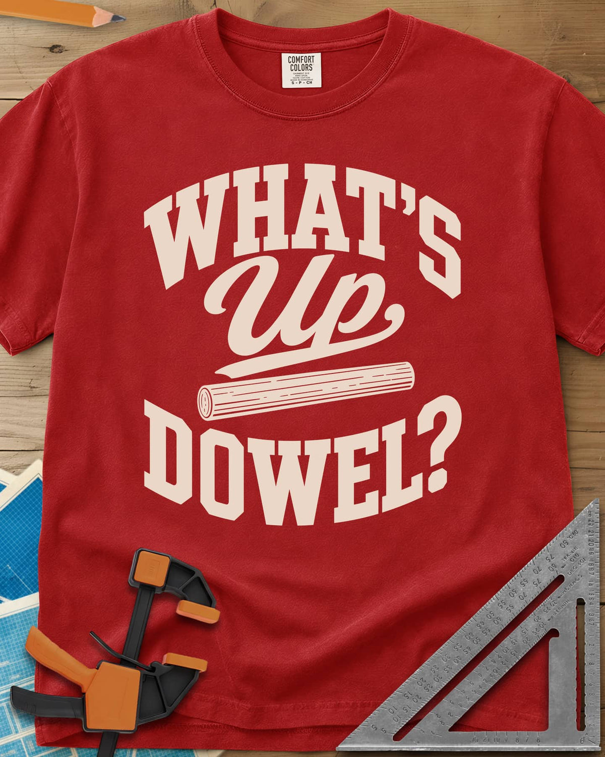 What'S Up Dowel heavyweight tee in Red, a wooden dowel under a script Up between slab-style words