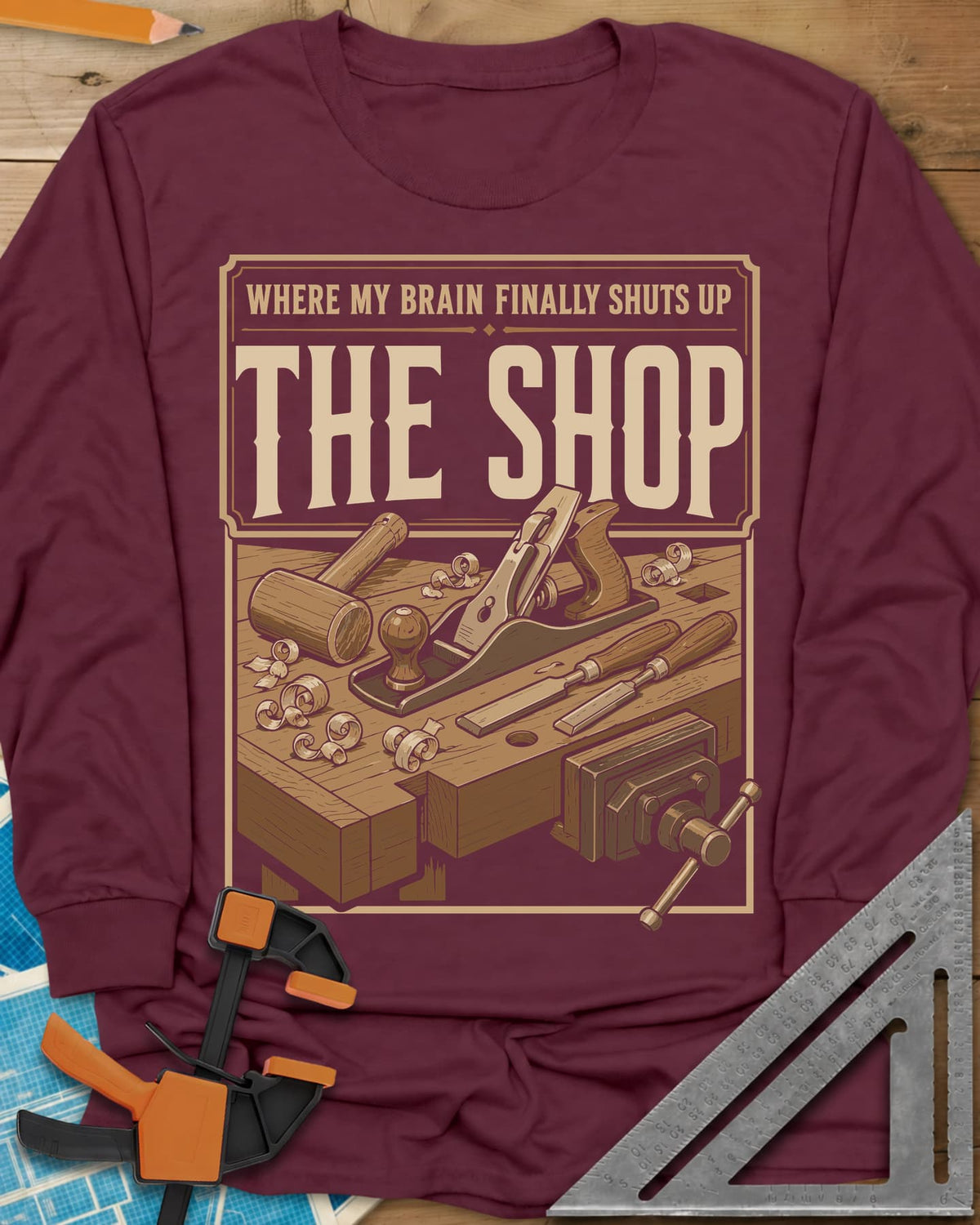 Where My Brain Finally Shuts Up long sleeve shirt in Maroon, a framed workbench poster with plane, mallet, chisels and vise