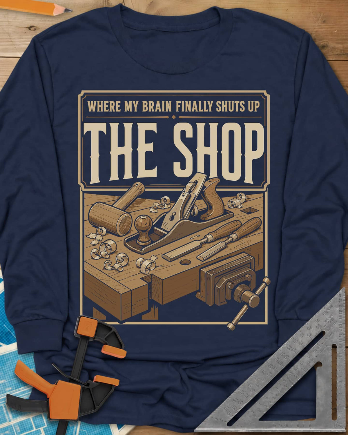 Where My Brain Finally Shuts Up long sleeve shirt in Navy, a framed workbench poster with plane, mallet, chisels and vise
