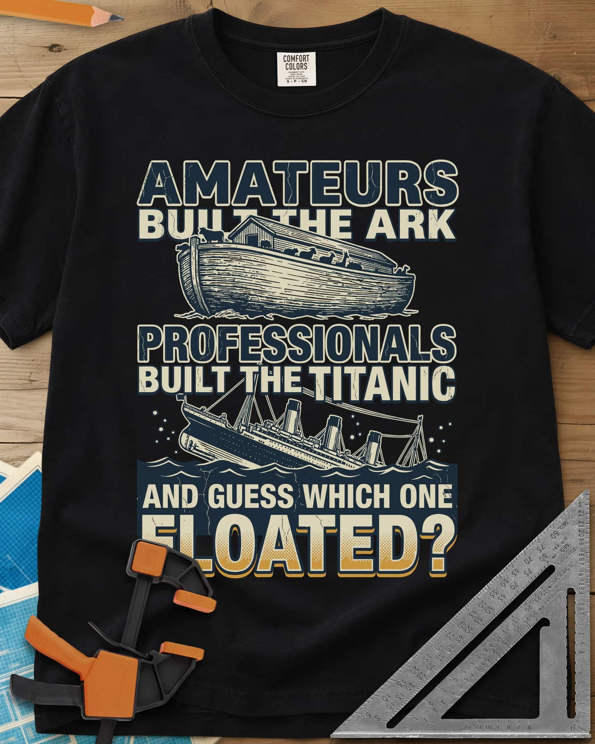 Which One Floated heavyweight tee in Black, a wooden ark and a sinking ocean liner between lines of text