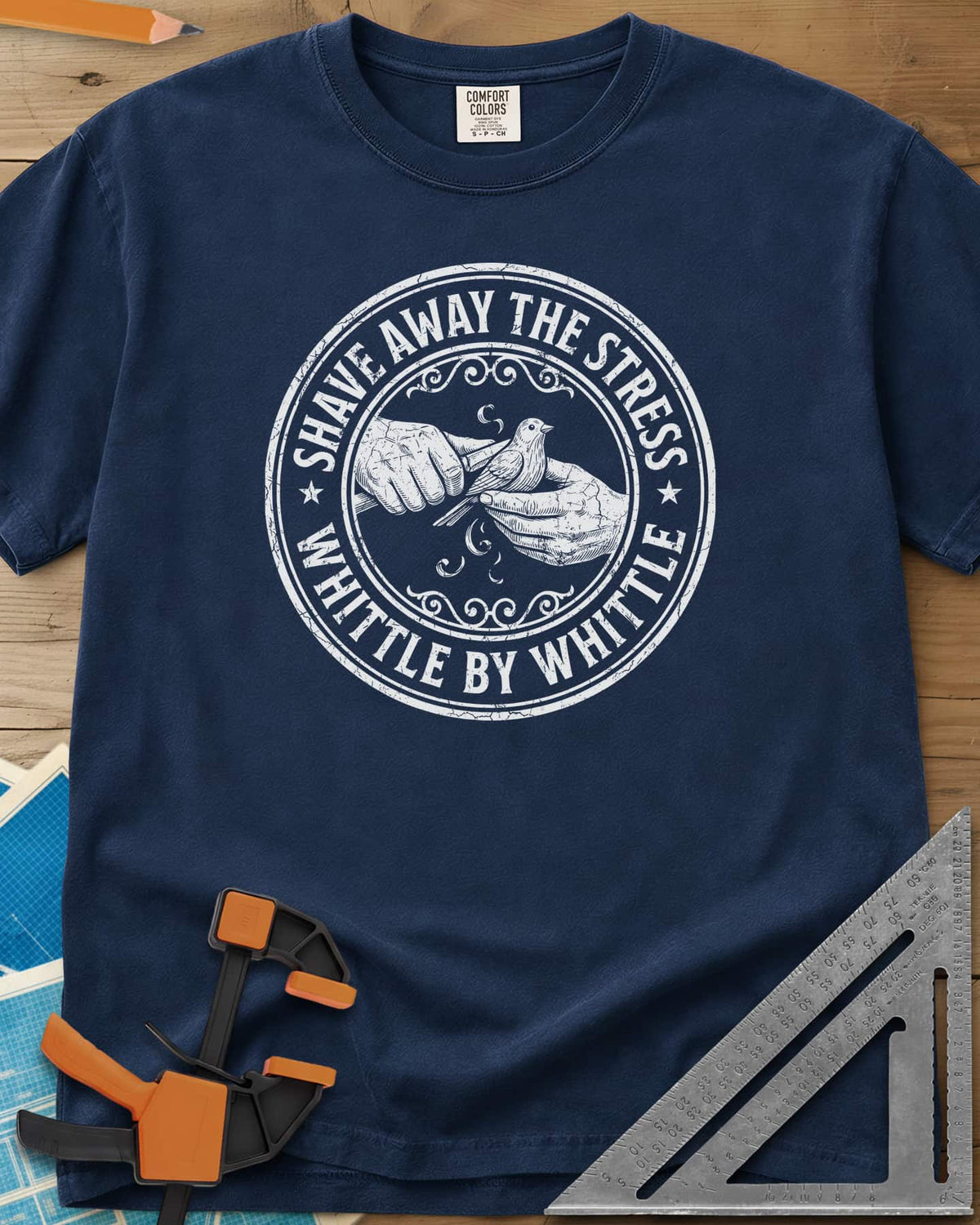 Whittle by Whittle heavyweight tee in Navy, two hands whittling a small bird inside a round distressed badge