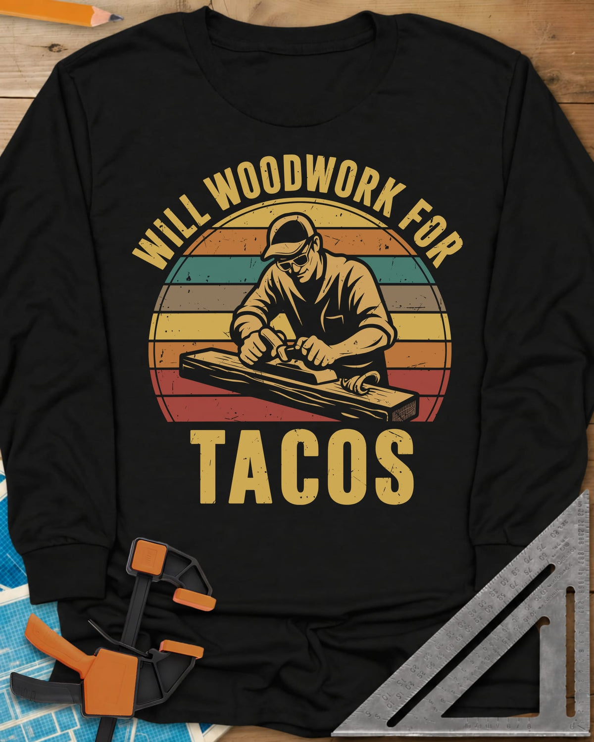 Will Woodwork For Tacos long sleeve shirt in Black, a capped woodworker planing a board before retro sunset stripes