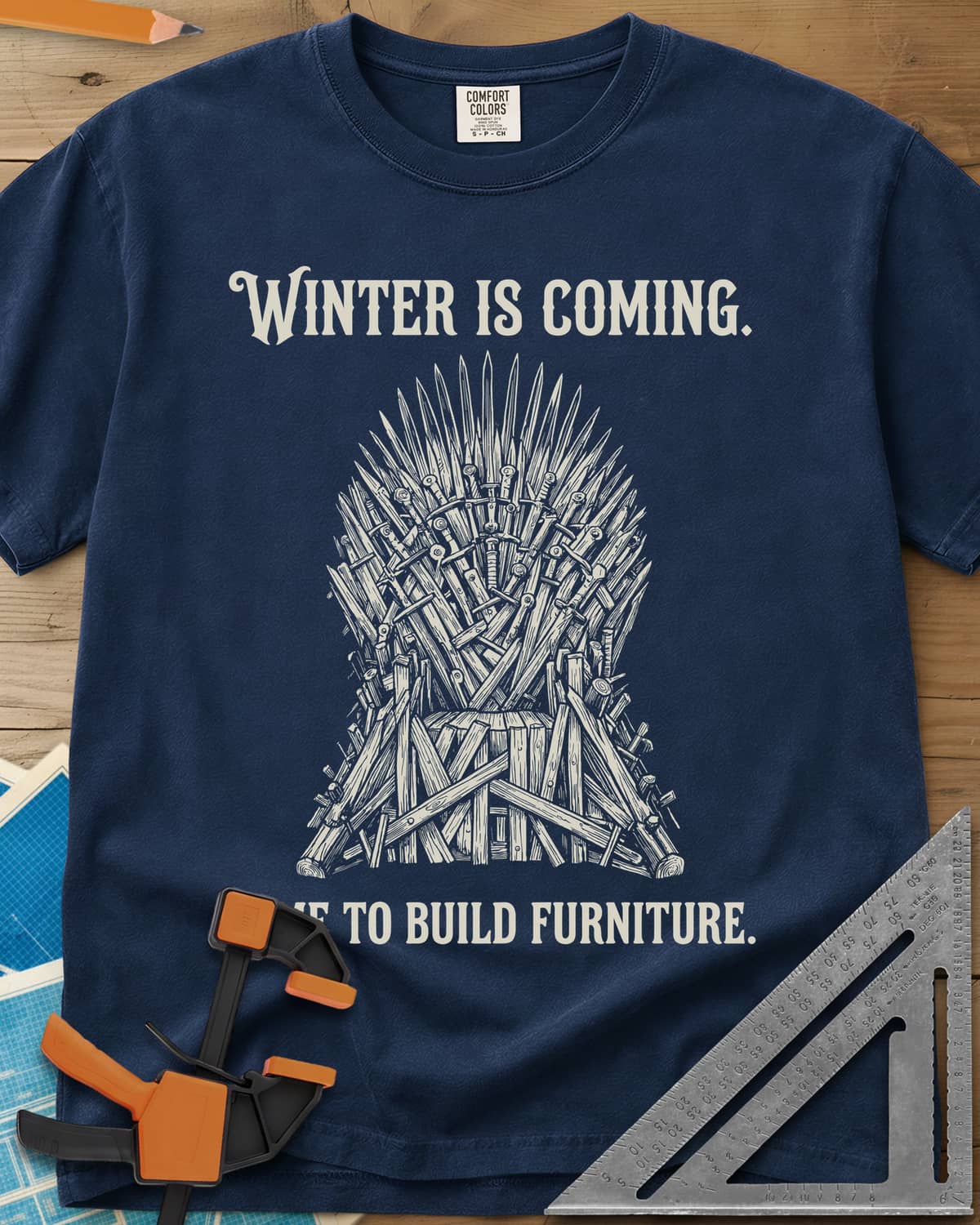 Winter Is Coming Time To Build Furniture heavyweight tee in Navy, a spiky throne of blades and rough planks between two lines