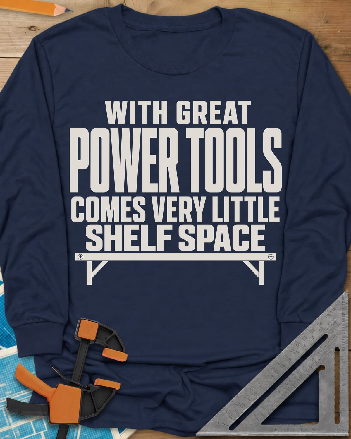 With Great Power Tools long sleeve shirt in Navy, a bare wall shelf with brackets and screws under the slogan