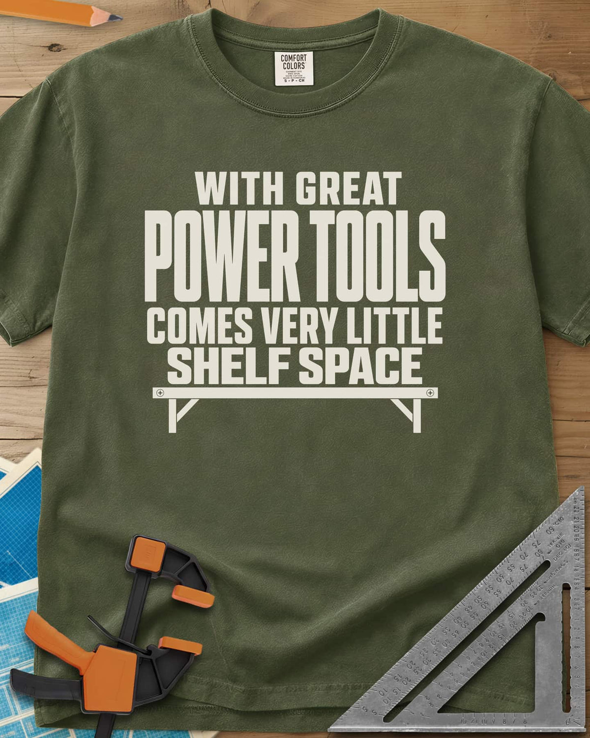 With Great Power Tools heavyweight tee in Hemp, a bare wall shelf with brackets and screws under the slogan