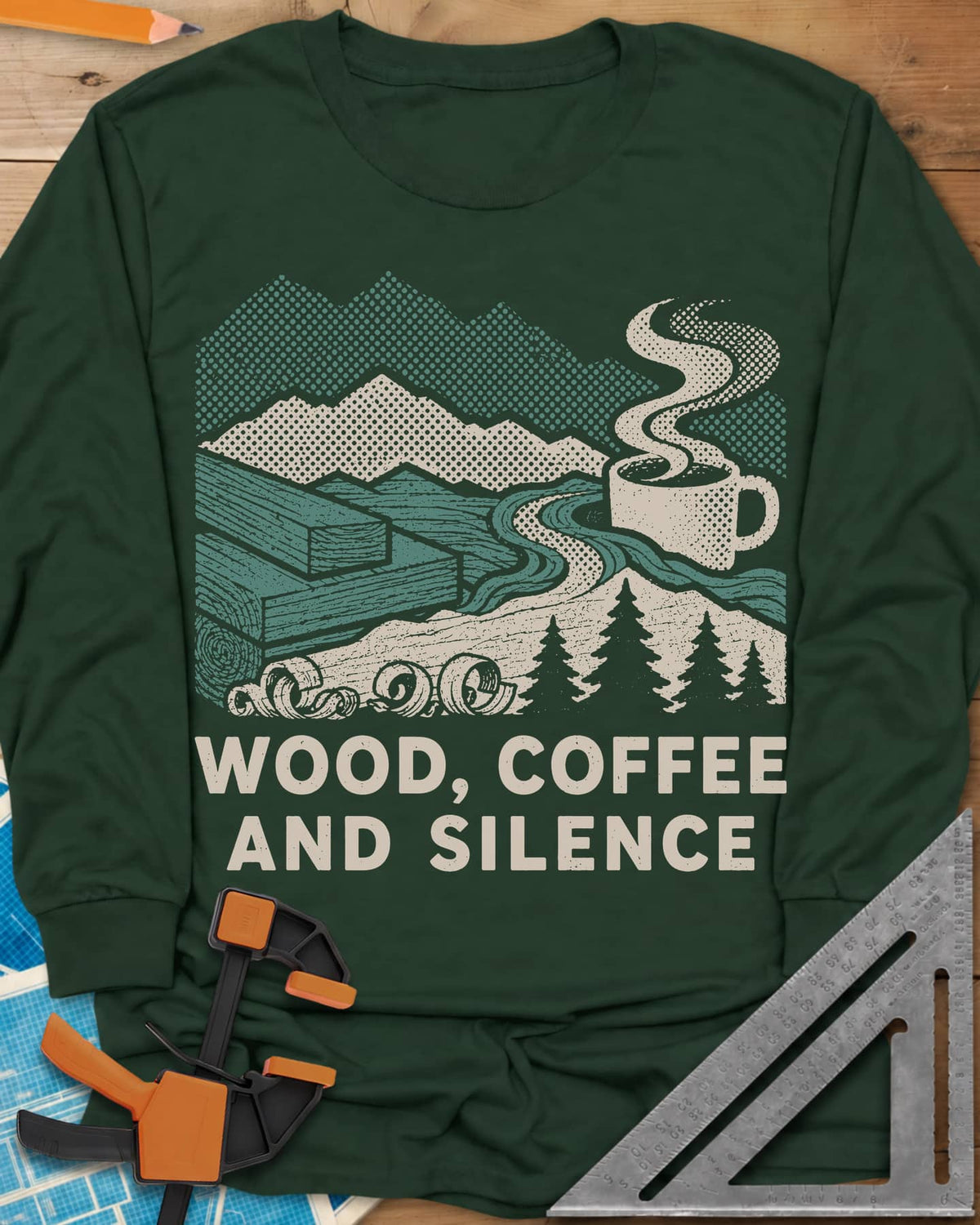 Wood Coffee Silence long sleeve shirt in Forest Green, mountains, stacked lumber, pines and a steaming coffee cup