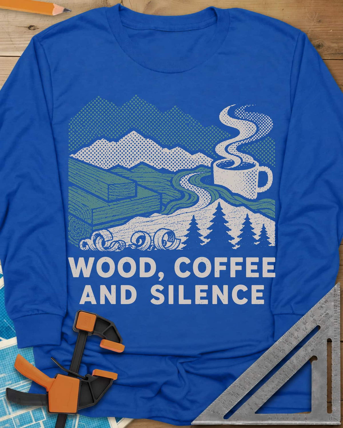 Wood Coffee Silence long sleeve shirt in Royal, mountains, stacked lumber, pines and a steaming coffee cup