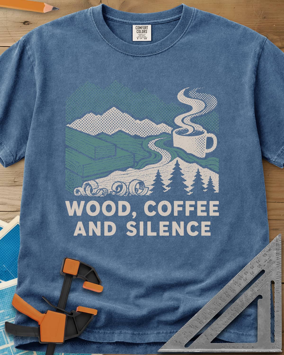 Wood Coffee Silence heavyweight tee in Blue Jean, mountains, stacked lumber, pines and a steaming coffee cup
