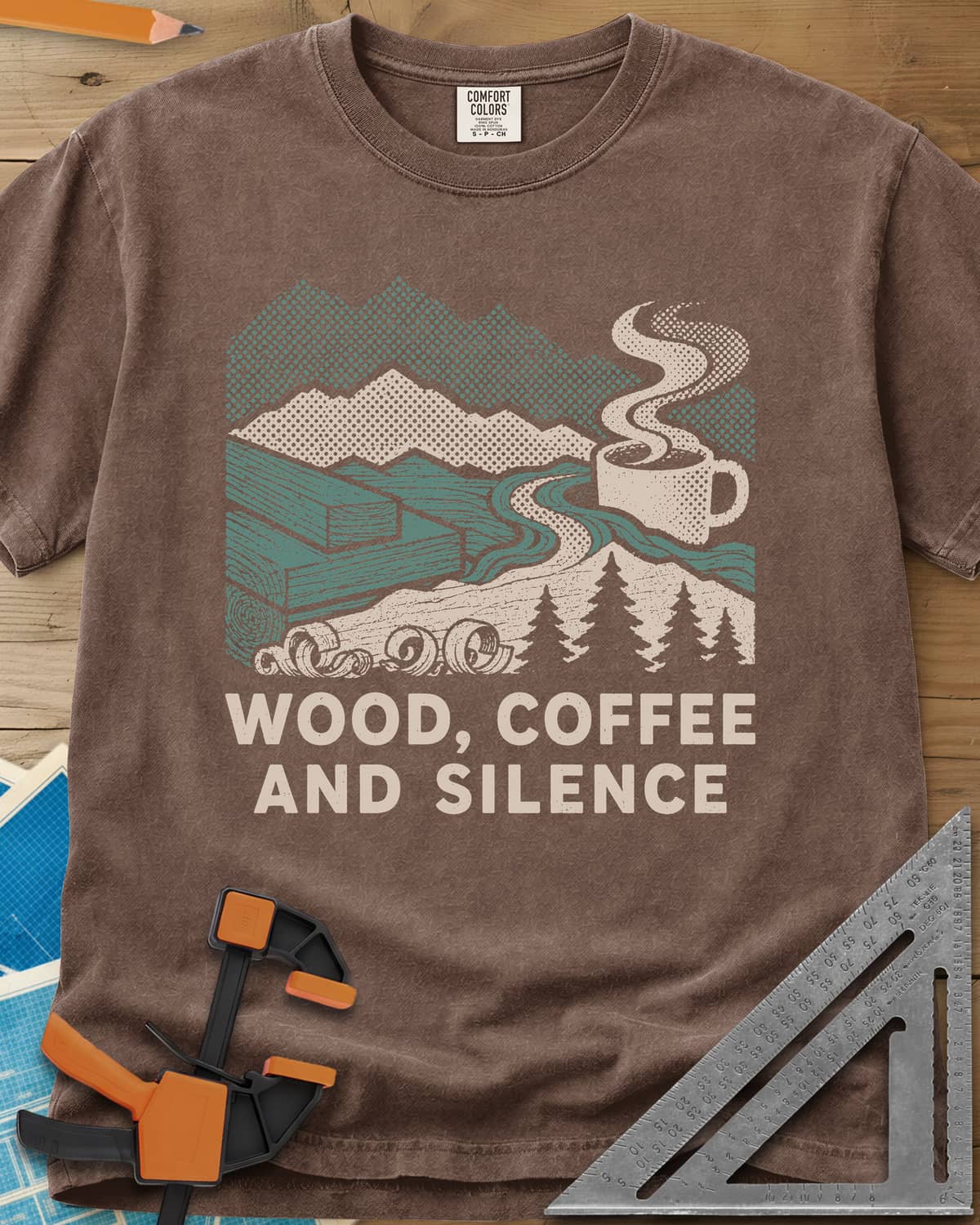 Wood Coffee Silence heavyweight tee in Espresso, mountains, stacked lumber, pines and a steaming coffee cup