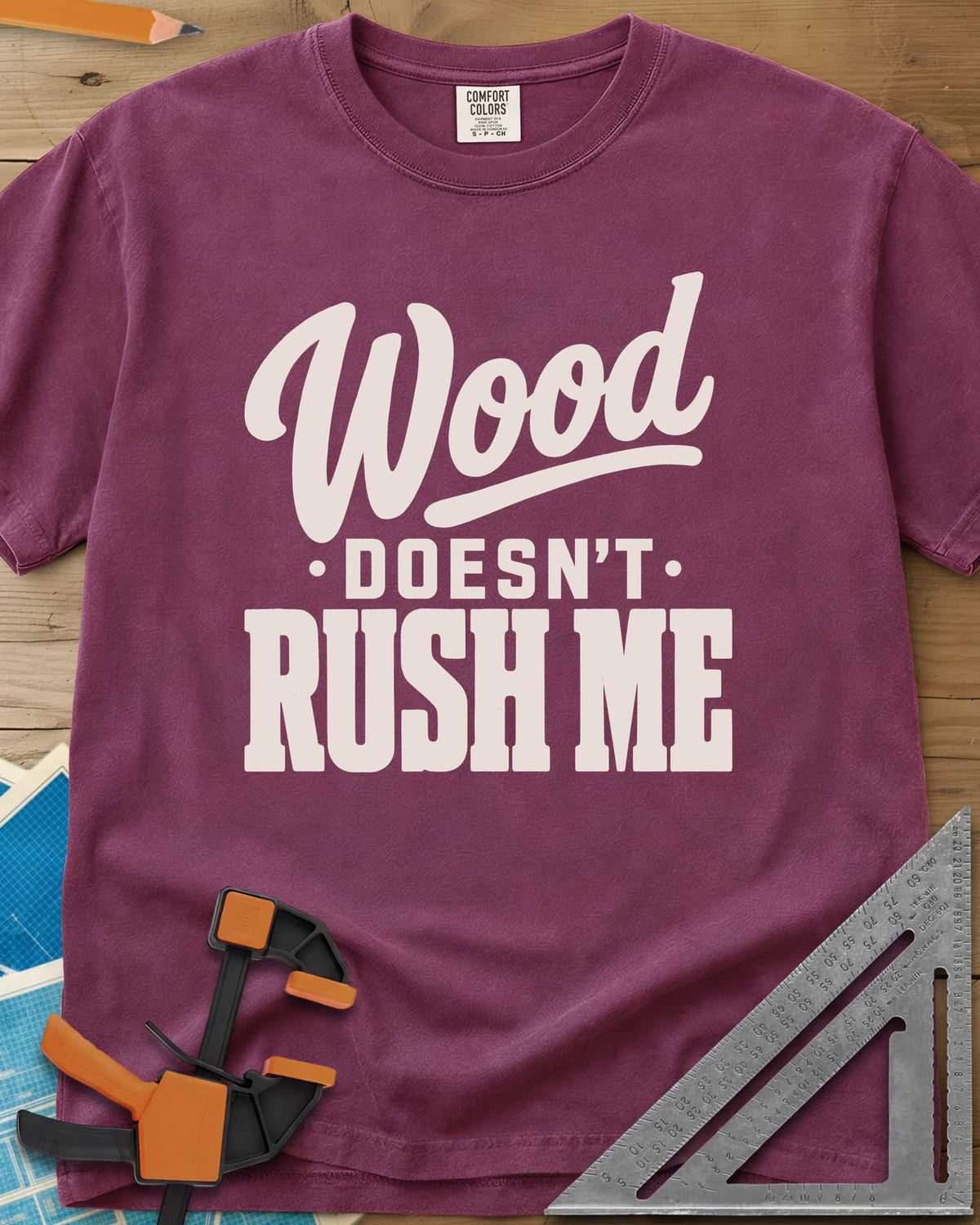 Wood Doesn'T Rush heavyweight tee in Berry, script and block lettering in cream and gold, no graphics