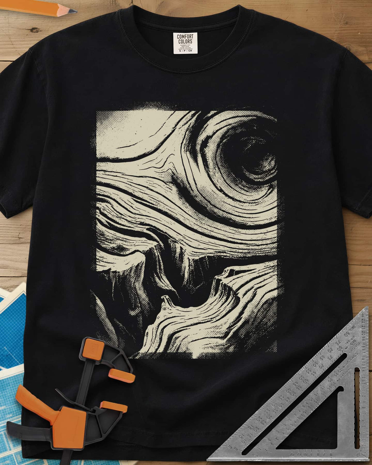 Wood Grain Skull heavyweight tee in Black, a skull hiding in swirling halftone wood grain