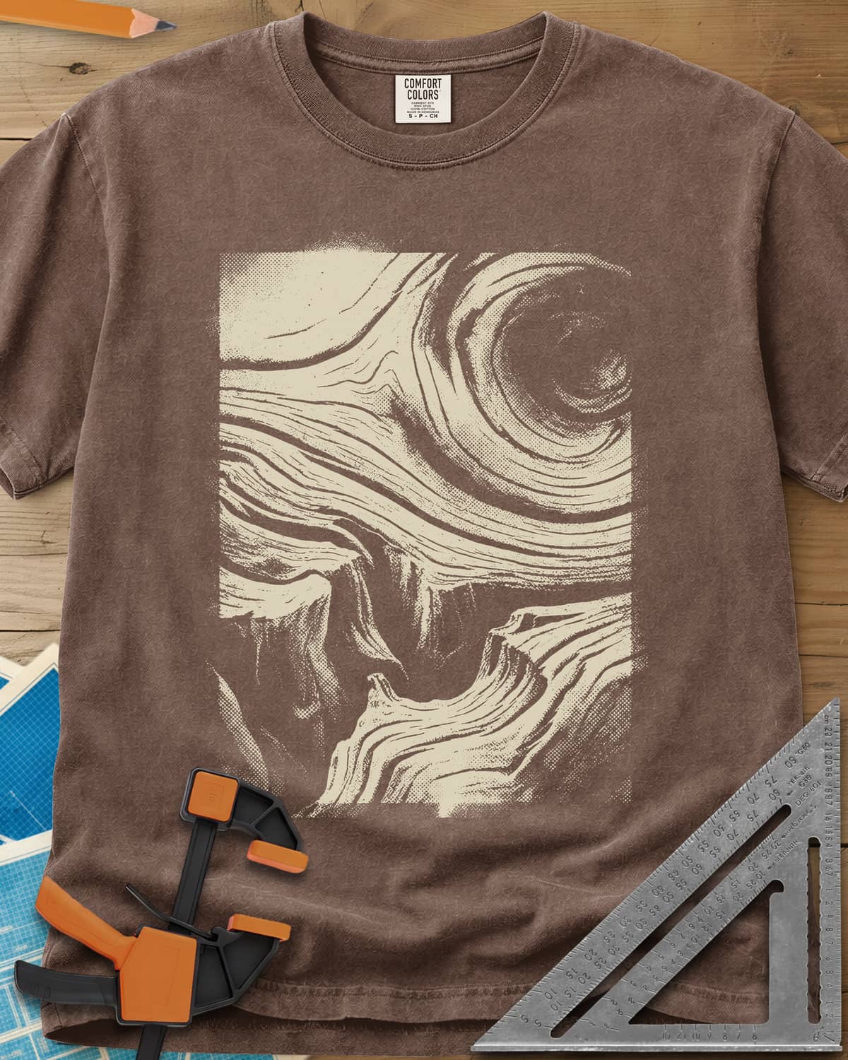 Wood Grain Skull heavyweight tee in Espresso, a skull hiding in swirling halftone wood grain