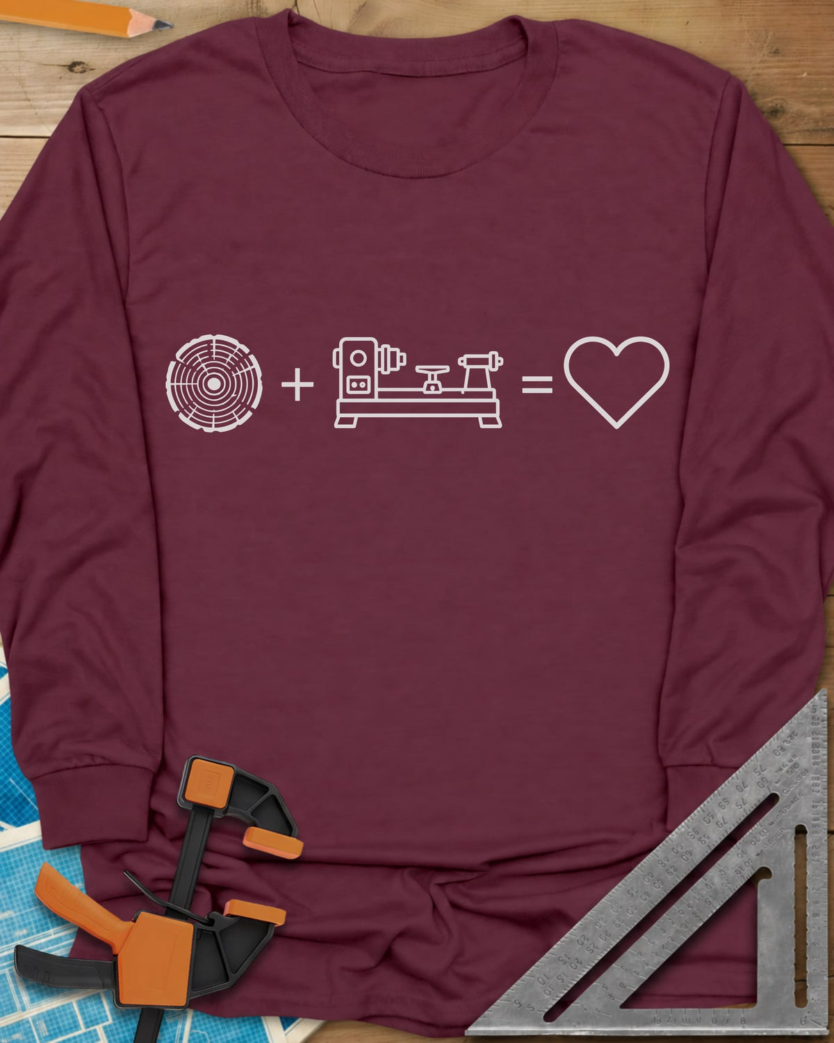 Wood + Lathe = Love long sleeve shirt in Maroon, a log slice plus a wood lathe equals a heart in white line art