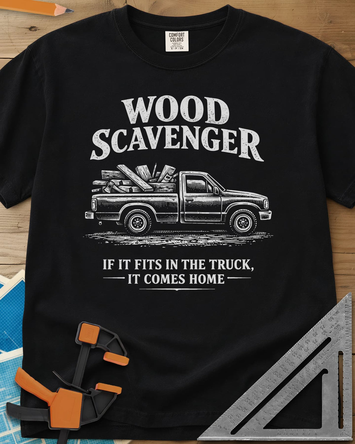 Wood Scavenger heavyweight tee in Black, a pickup truck loaded with boards, offcuts and an axe