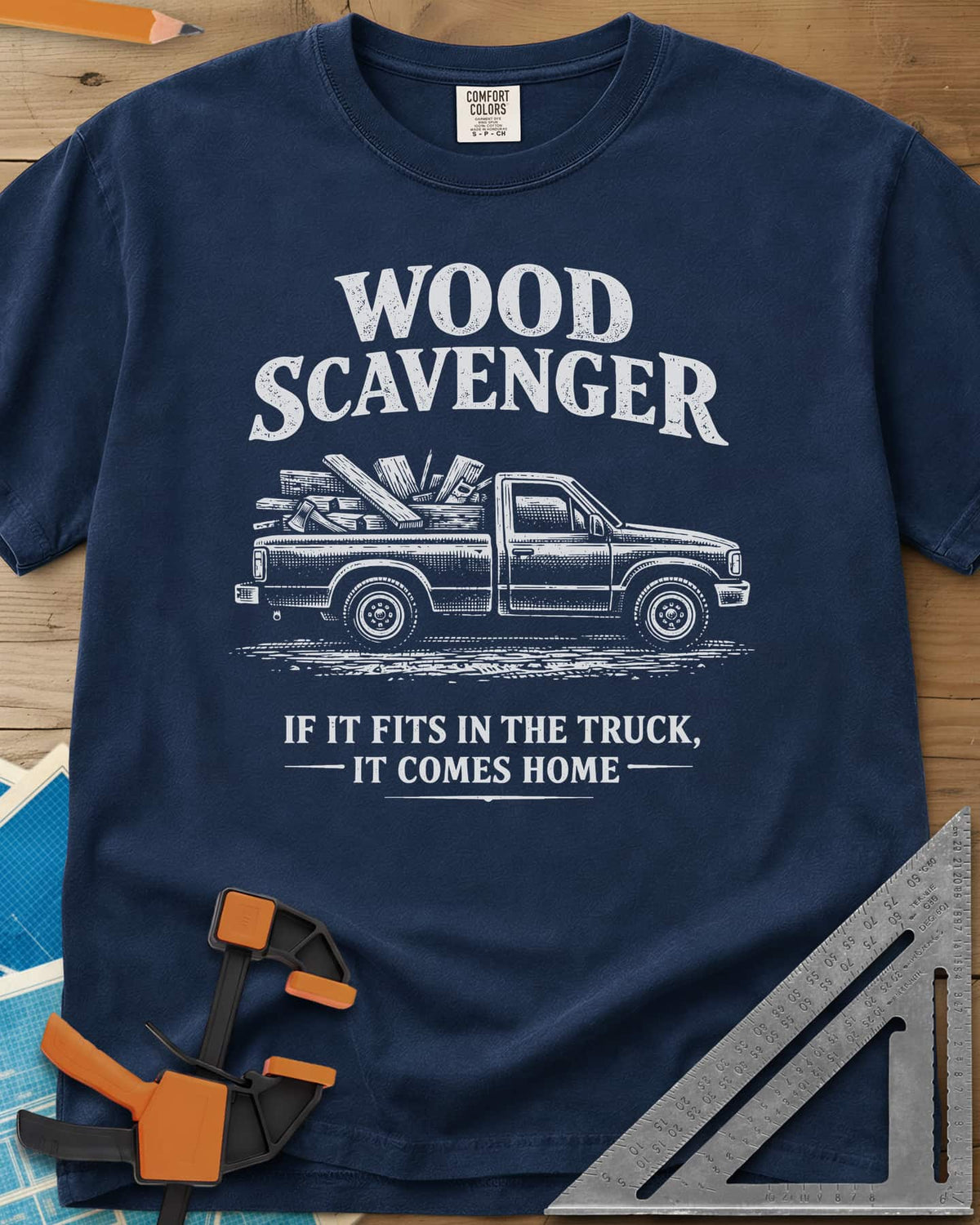 Wood Scavenger heavyweight tee in Navy, a pickup truck loaded with boards, offcuts and an axe