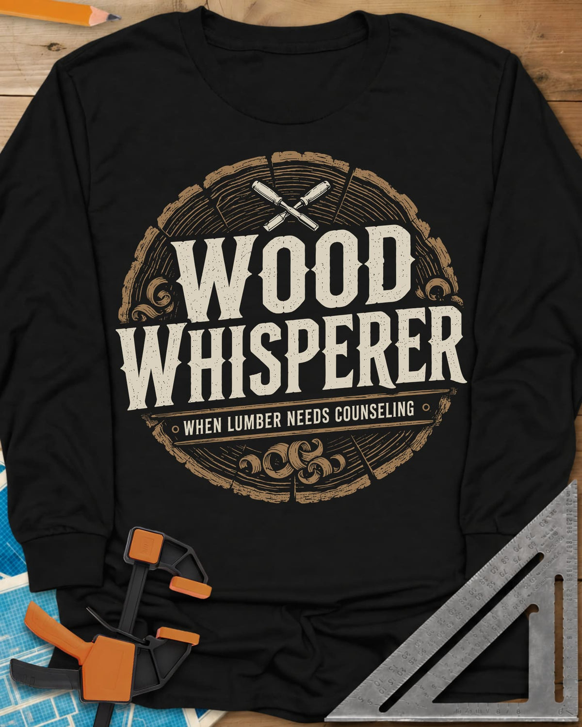 Wood Whisperer long sleeve shirt in Black, a round log-slice badge with crossed chisels and shaving curls