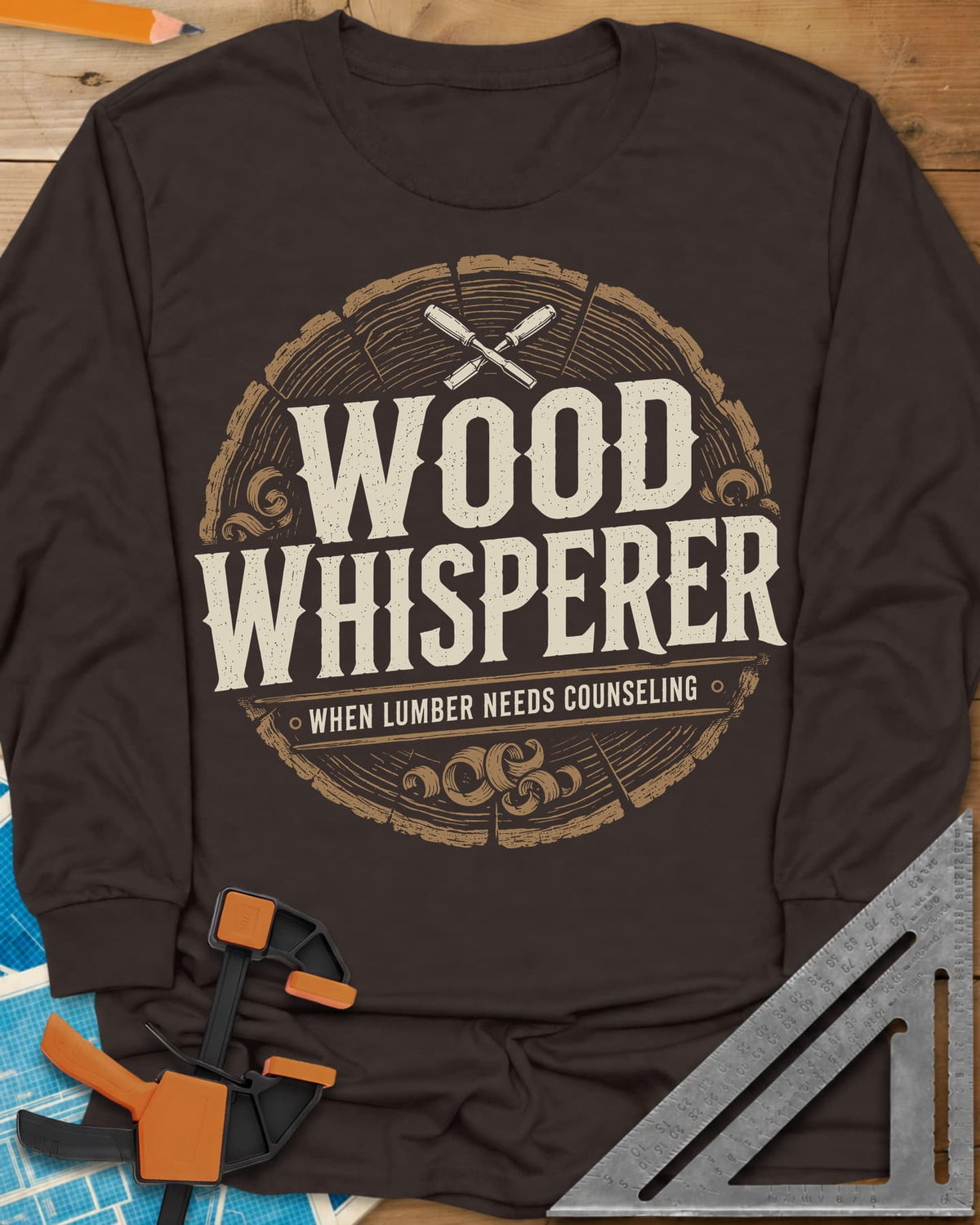 Wood Whisperer long sleeve shirt in Dark Chocolate, a round log-slice badge with crossed chisels and shaving curls