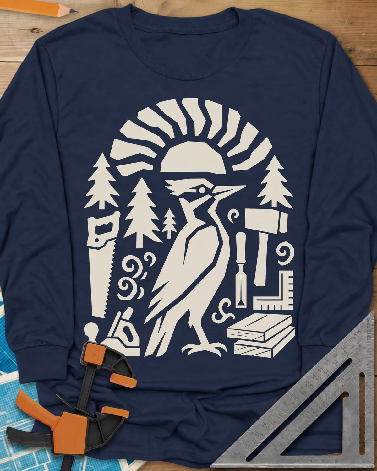 Woodpecker Craft long sleeve shirt in Navy, a geometric woodpecker among saws, planes, chisels and pine trees