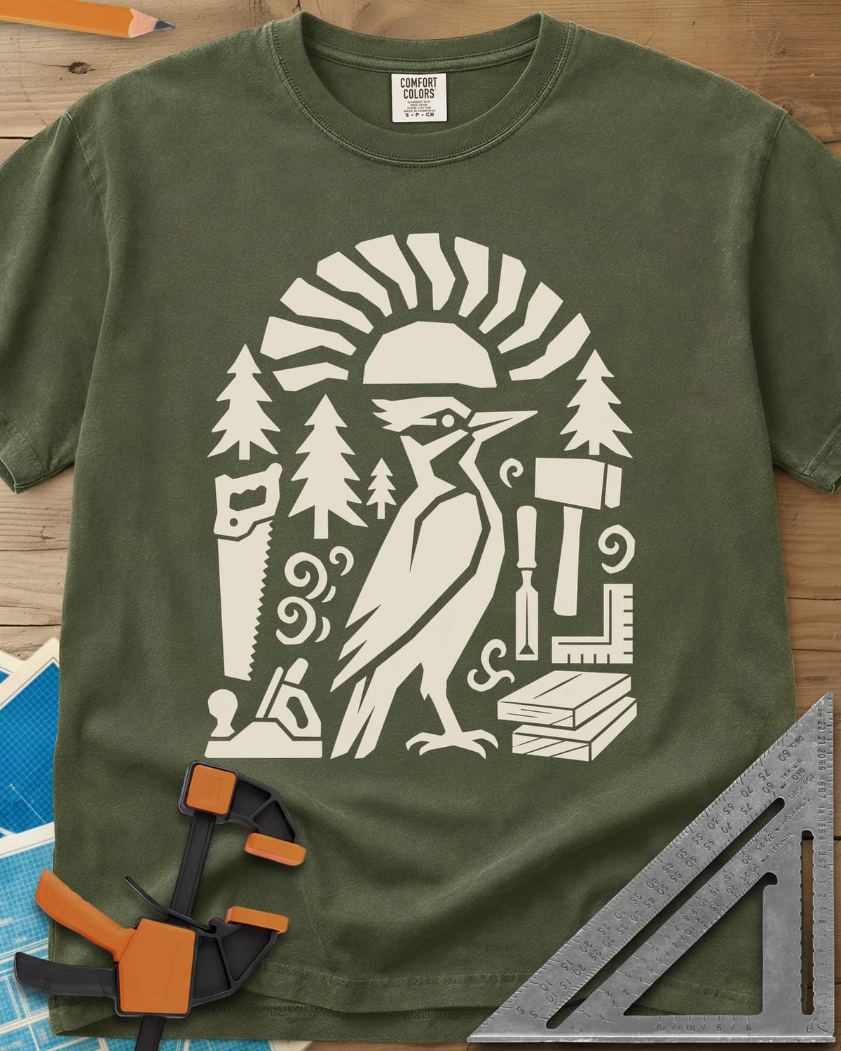 Woodpecker Craft heavyweight tee in Hemp, a geometric woodpecker among saws, planes, chisels and pine trees