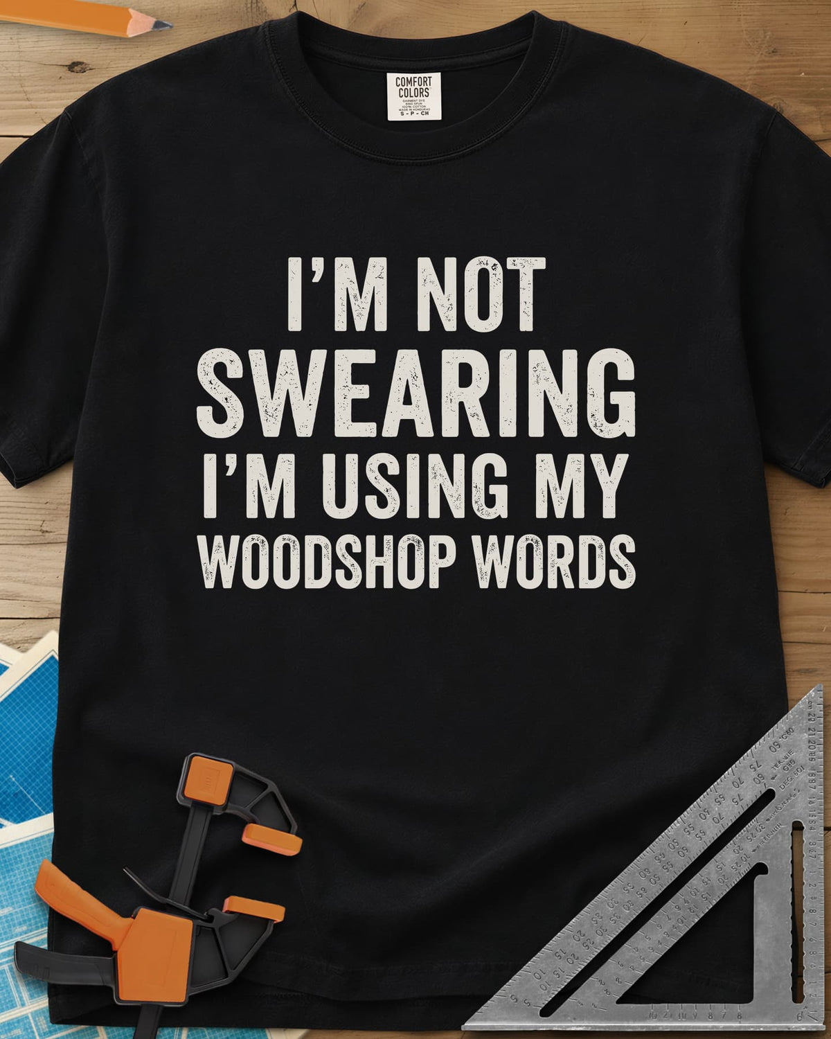 Woodshop Words heavyweight tee in Black, distressed all-caps lettering, no graphics