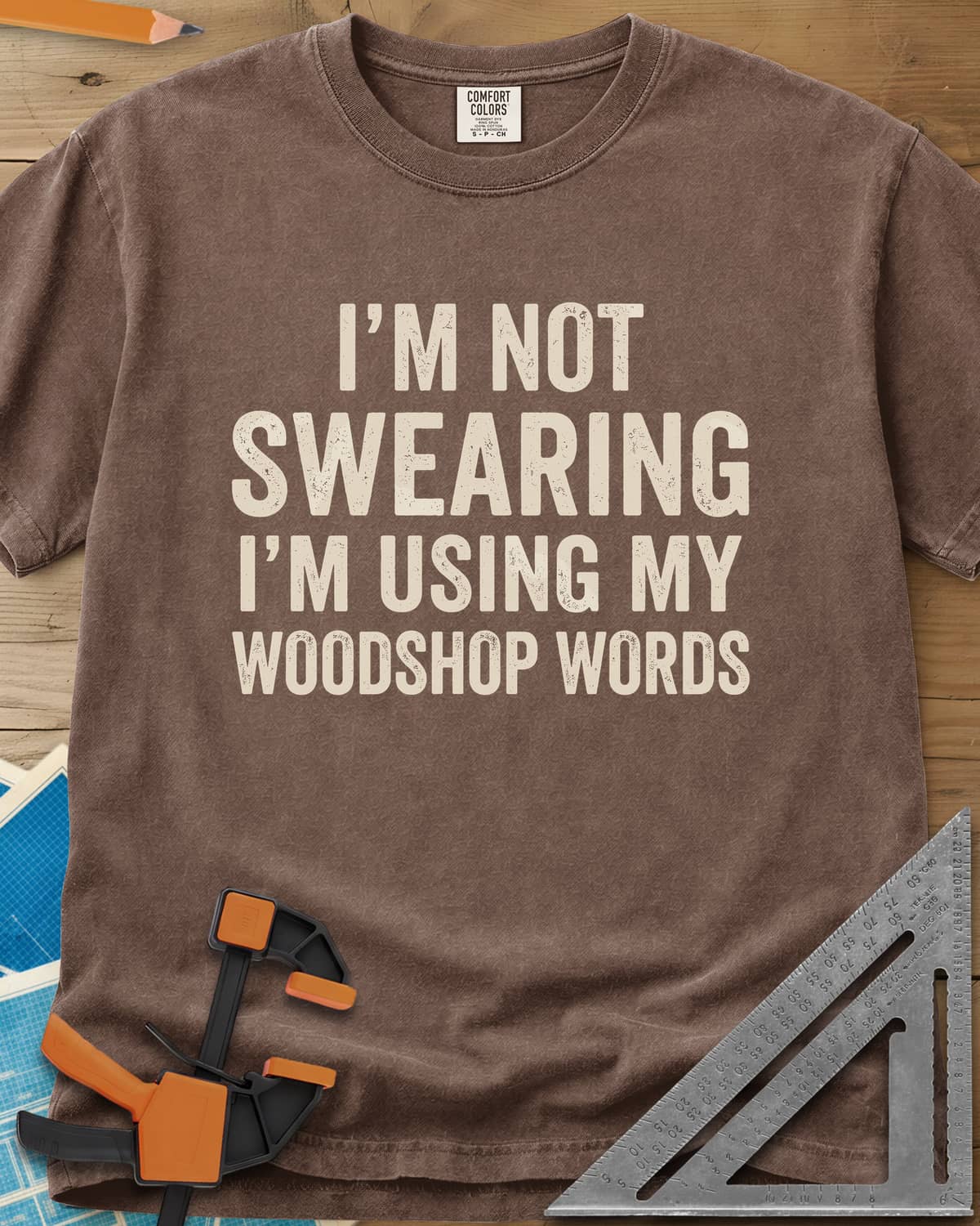 Woodshop Words heavyweight tee in Espresso, distressed all-caps lettering, no graphics