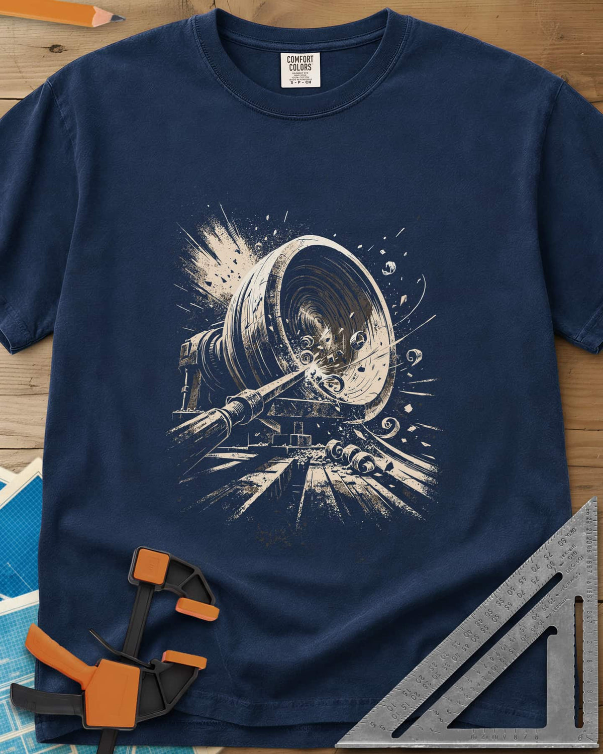 Woodturning Fury heavyweight tee in Navy, a wood lathe mid-cut with shavings and chips flying