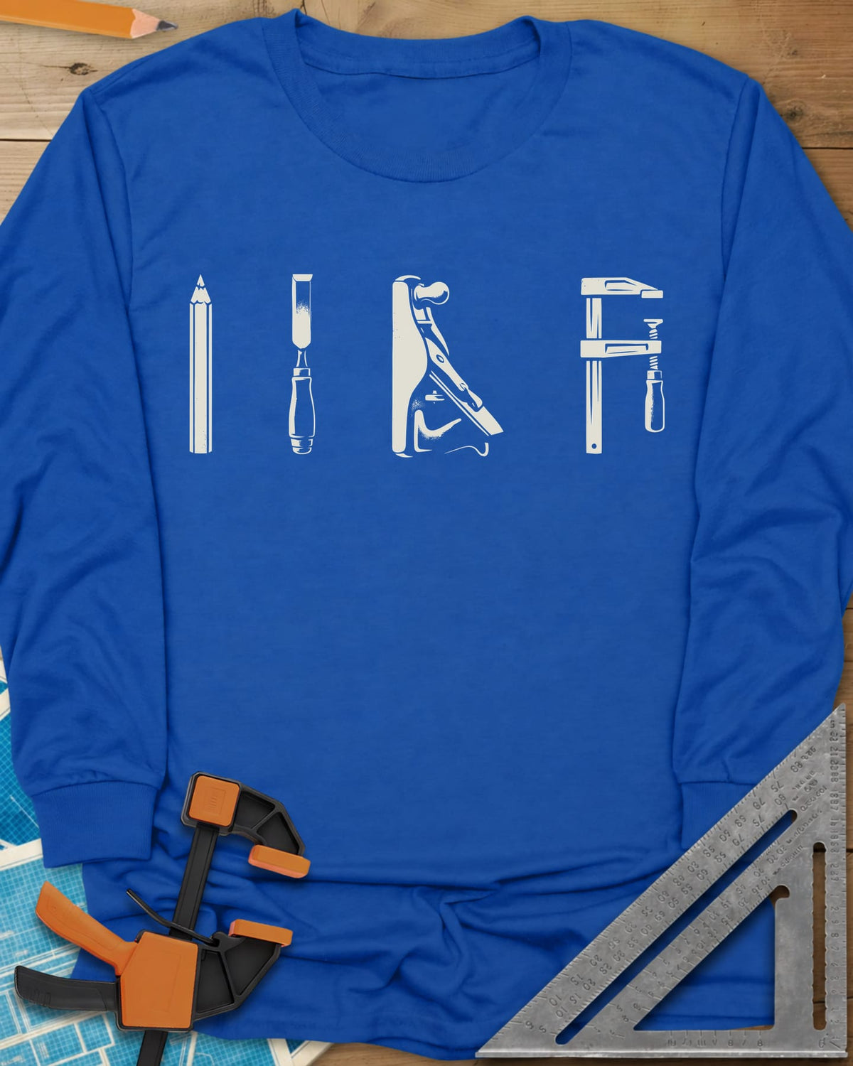 Woodworker Arsenal long sleeve shirt in Royal, four tools in a row: pencil, chisel, hand plane, bar clamp