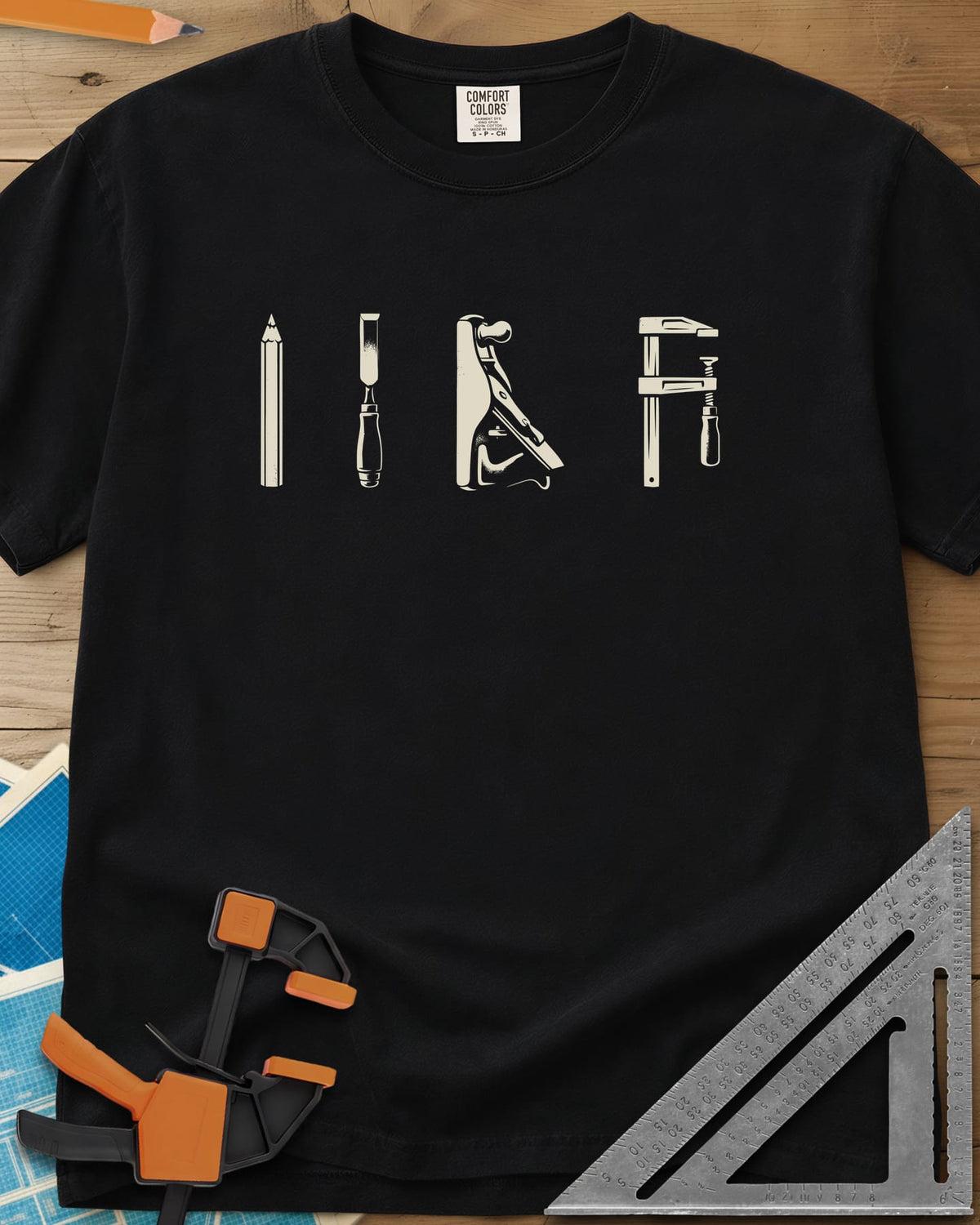 Woodworker Arsenal heavyweight tee in Black, four tools in a row: pencil, chisel, hand plane, bar clamp