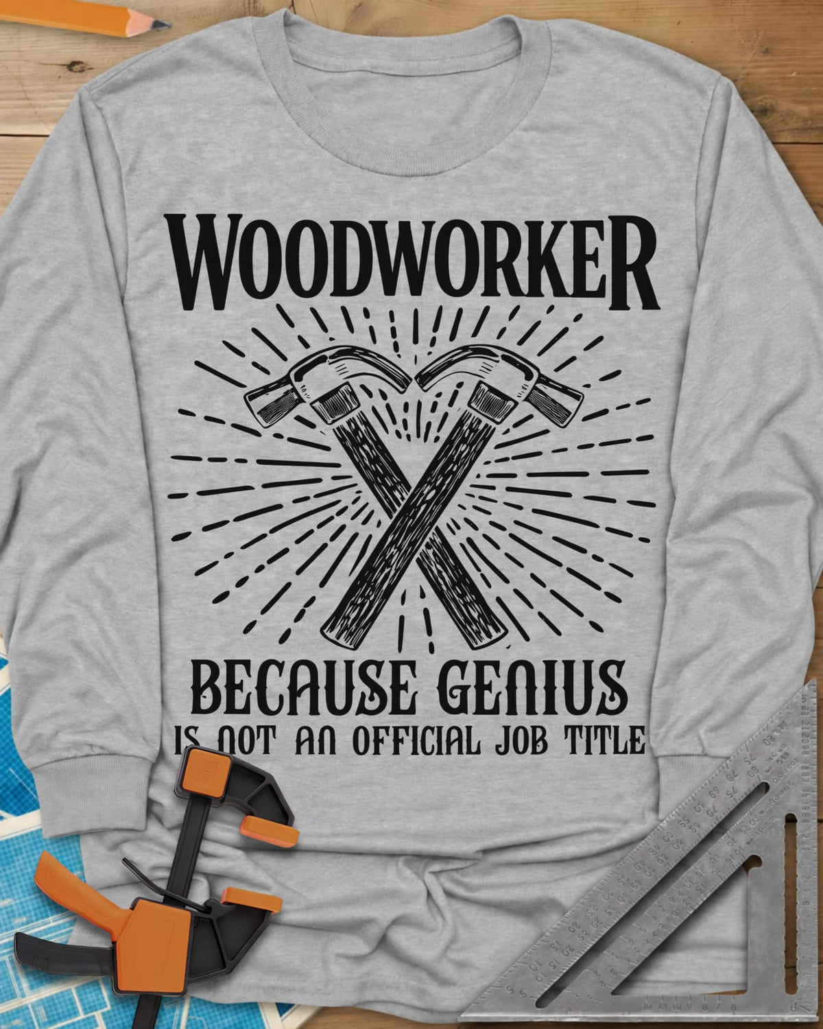 Woodworker Because Genius long sleeve shirt in Sport Grey, two crossed hammers inside a sunburst of fine lines