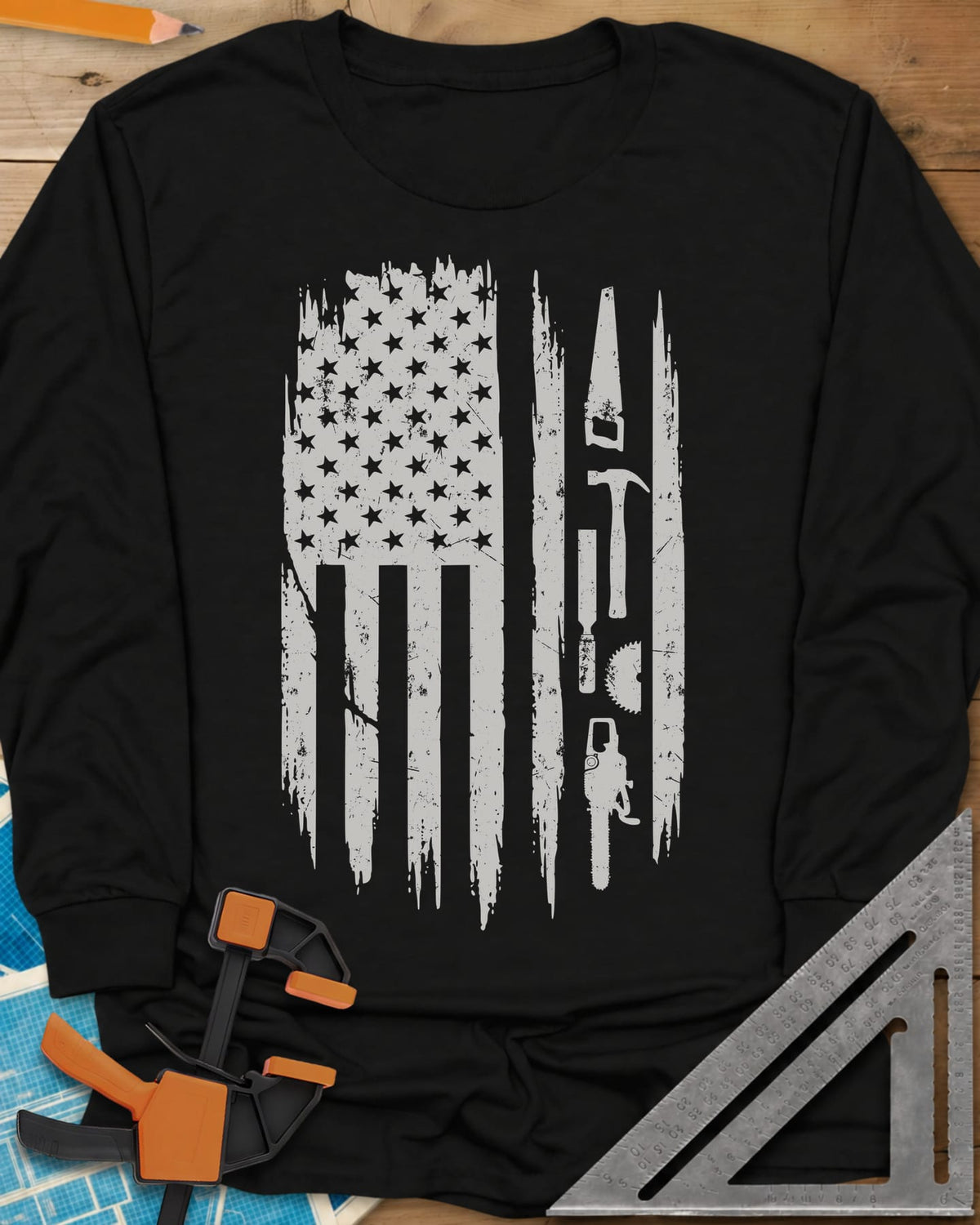 Woodworker Flag long sleeve shirt in Black, a distressed American flag with a hand saw, hammer and chainsaw