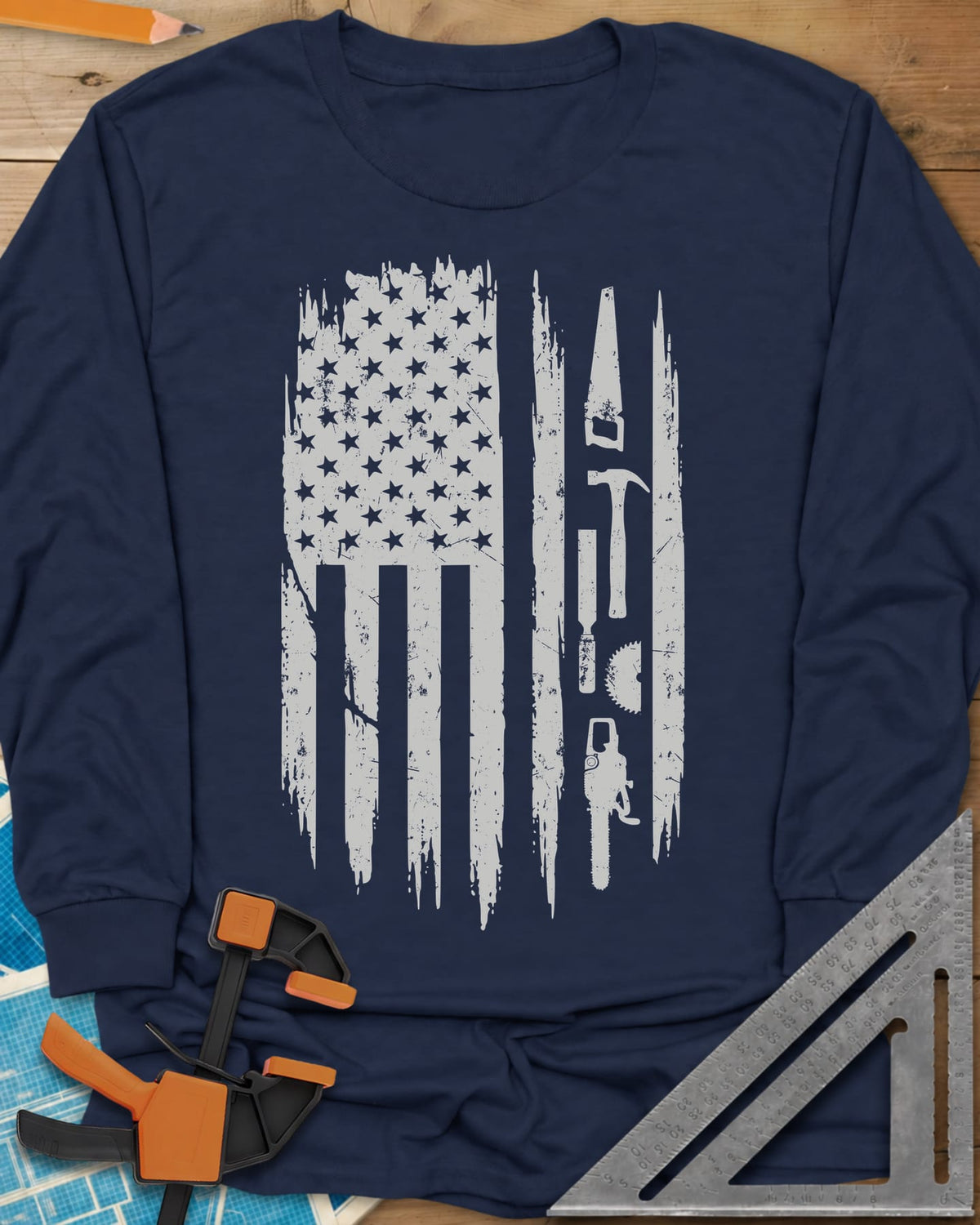 Woodworker Flag long sleeve shirt in Navy, a distressed American flag with a hand saw, hammer and chainsaw