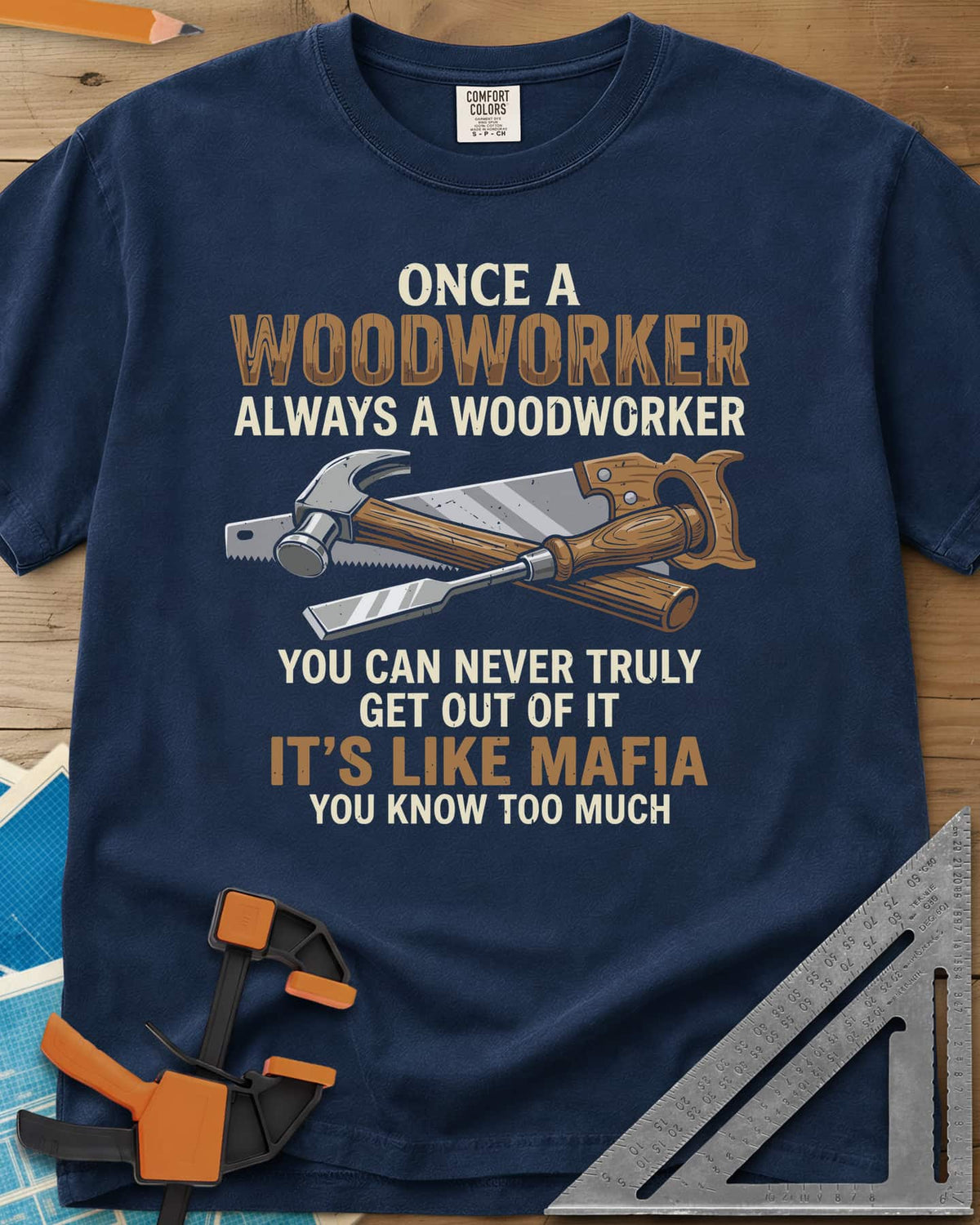 Woodworker For Life heavyweight tee in Navy, a claw hammer, hand saw and chisel crossed in the middle