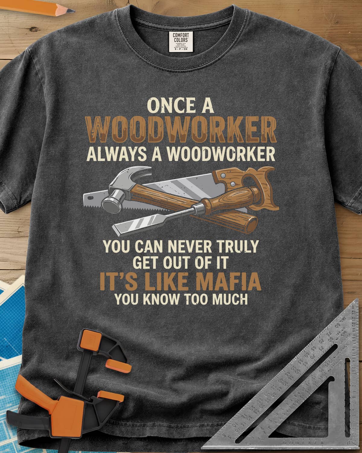Woodworker For Life heavyweight tee in Pepper, a claw hammer, hand saw and chisel crossed in the middle