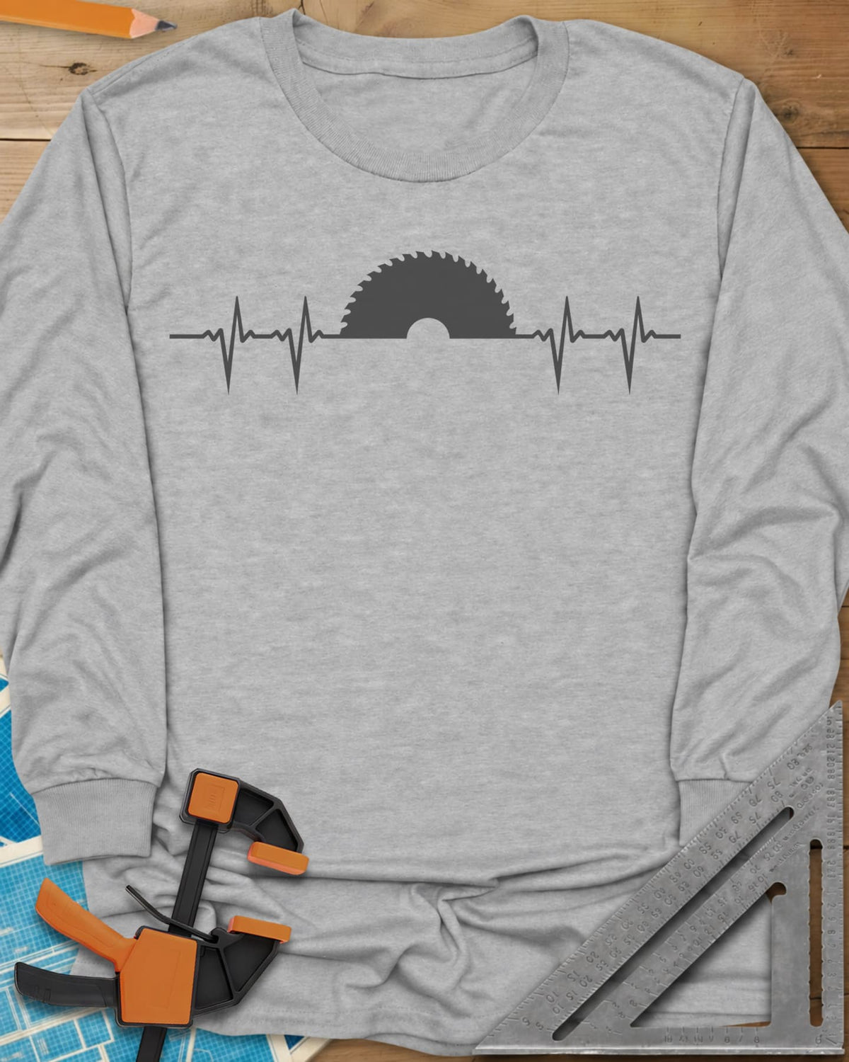 Woodworker Heartbeat long sleeve shirt in Sport Grey, a heartbeat line rising into a half saw blade
