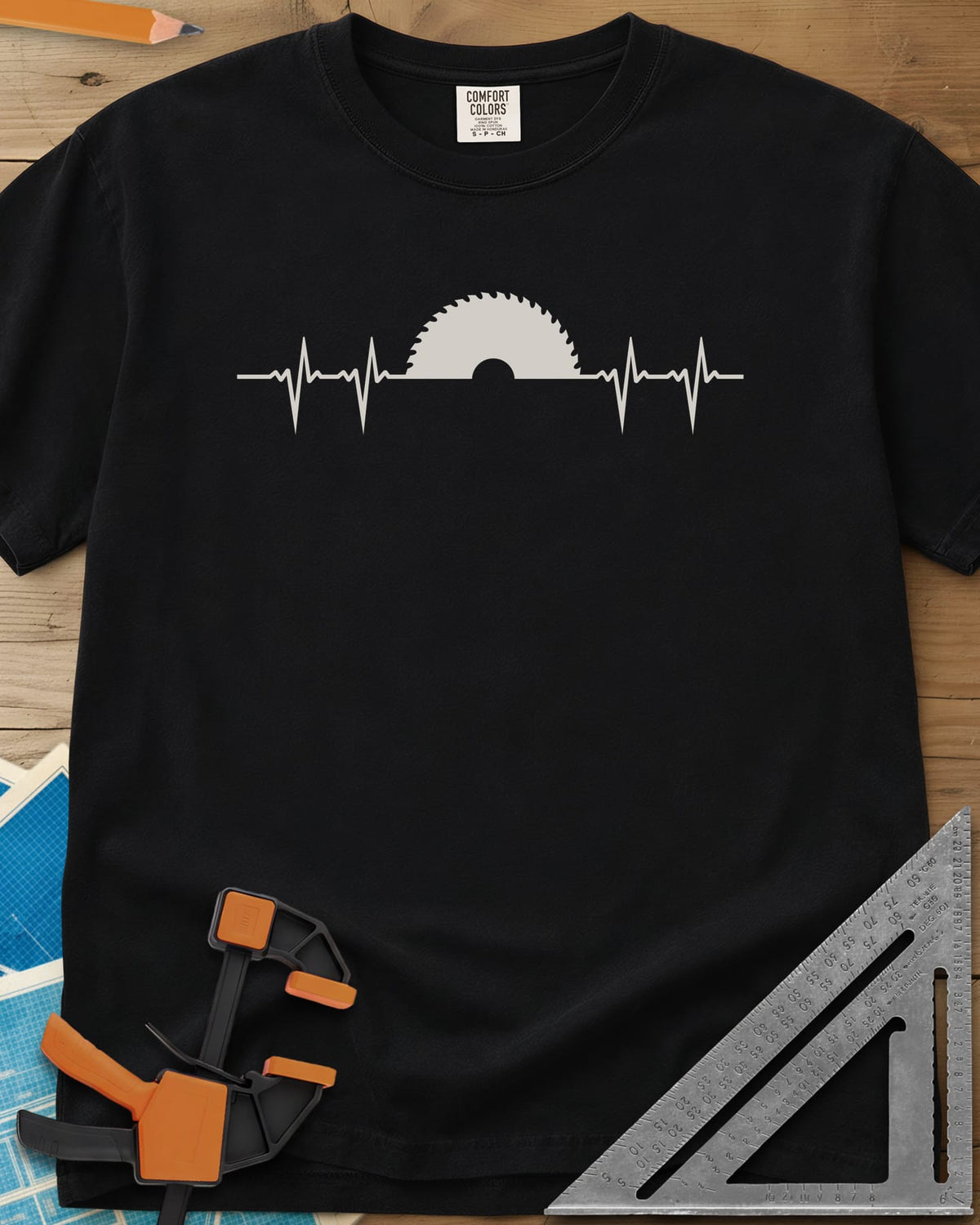 Woodworker Heartbeat heavyweight tee in Black, a heartbeat line rising into a half saw blade