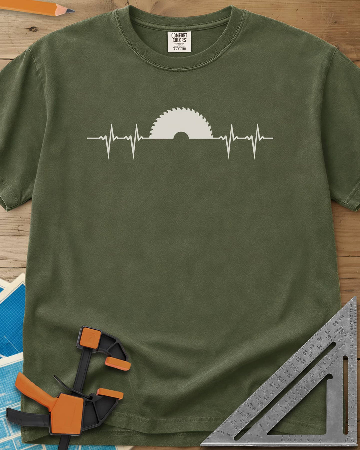 Woodworker Heartbeat heavyweight tee in Hemp, a heartbeat line rising into a half saw blade