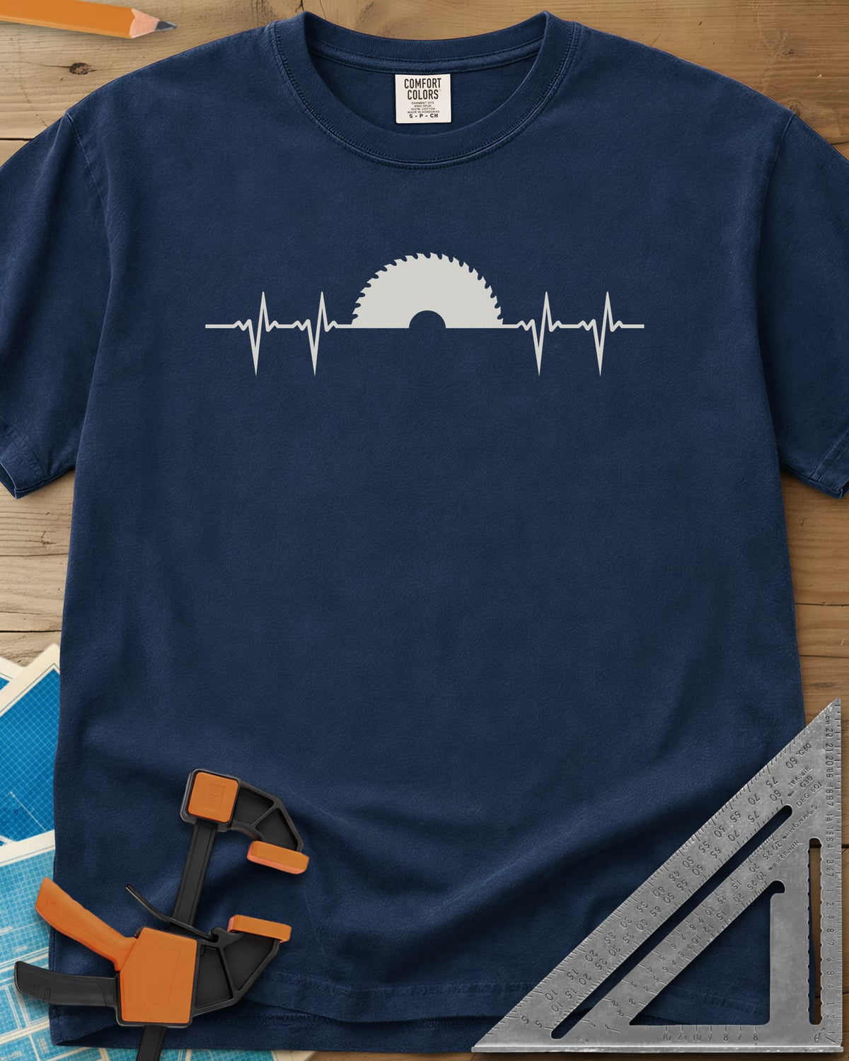 Woodworker Heartbeat heavyweight tee in Navy, a heartbeat line rising into a half saw blade