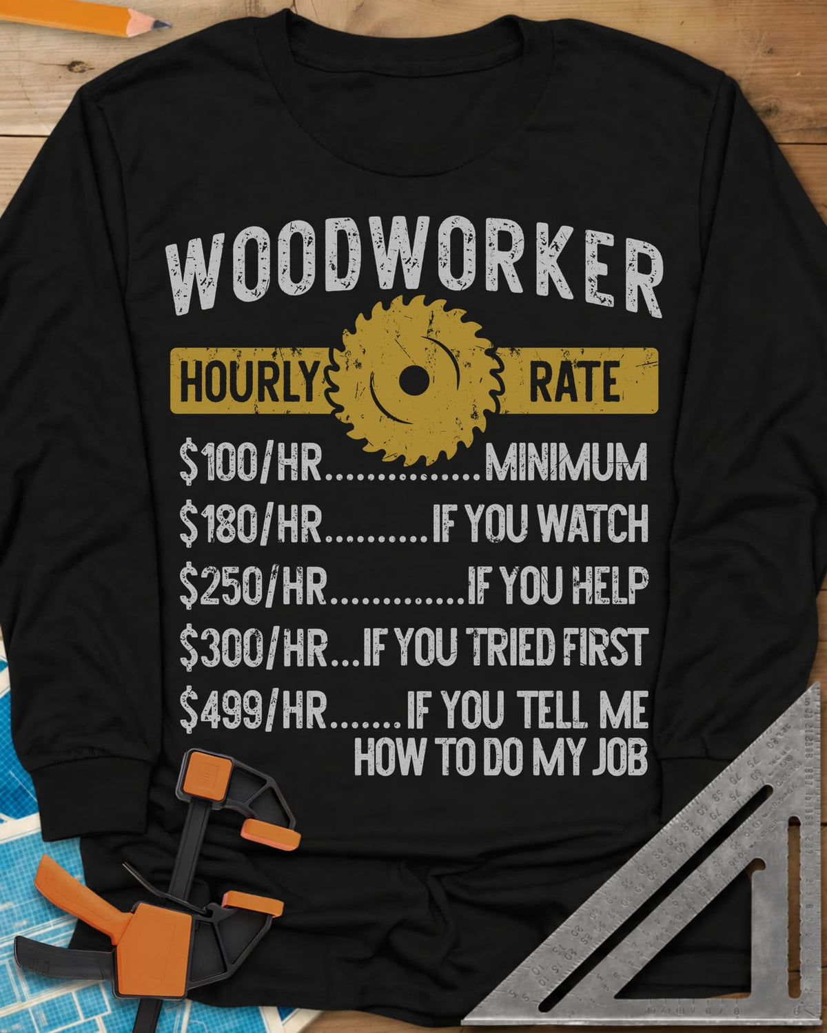 Woodworker Hourly Rate long sleeve shirt in Black, a rate sheet with a gold saw blade banner and gag hourly tiers