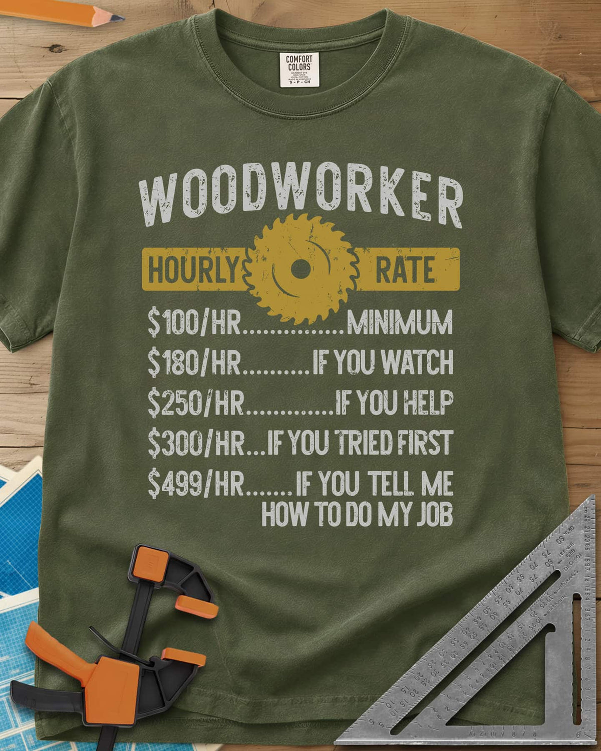 Woodworker Hourly Rate heavyweight tee in Hemp, a rate sheet with a gold saw blade banner and gag hourly tiers