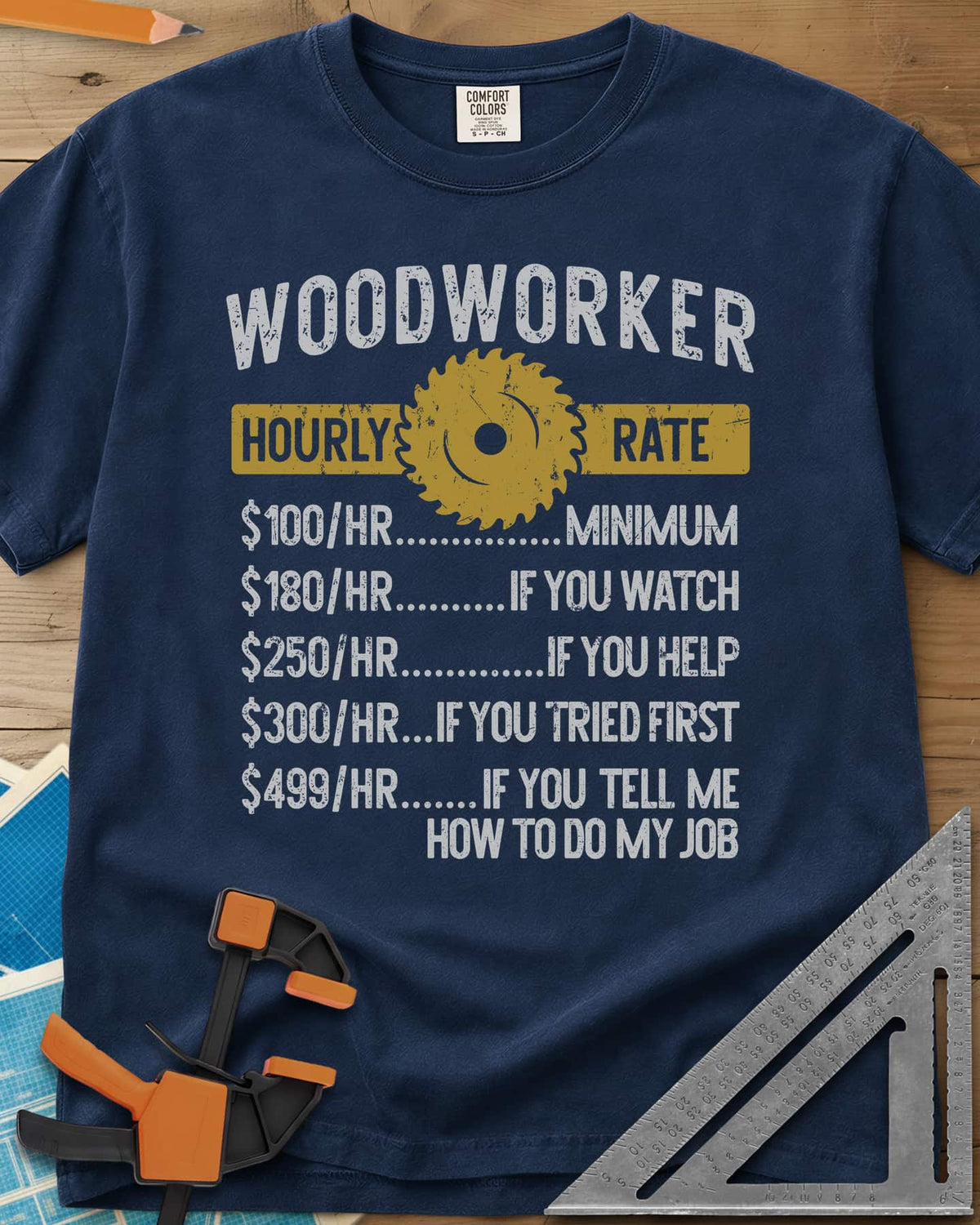 Woodworker Hourly Rate heavyweight tee in Navy, a rate sheet with a gold saw blade banner and gag hourly tiers