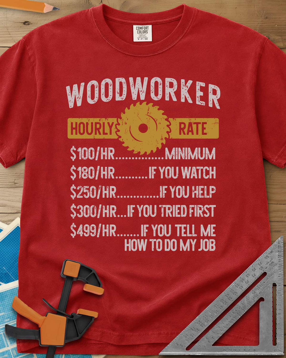 Woodworker Hourly Rate heavyweight tee in Red, a rate sheet with a gold saw blade banner and gag hourly tiers