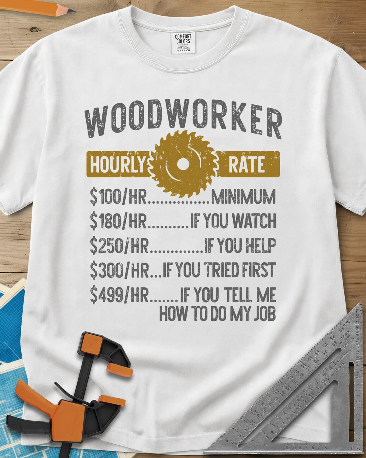 Woodworker Hourly Rate heavyweight tee in White, a rate sheet with a gold saw blade banner and gag hourly tiers
