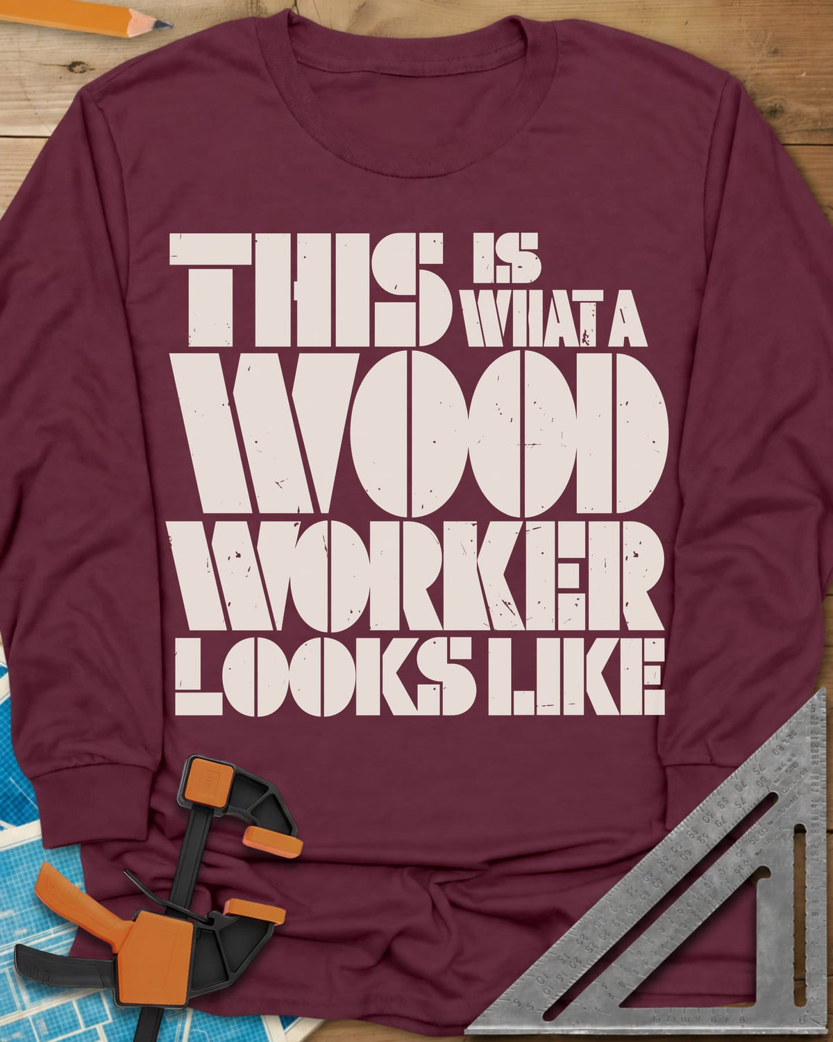 Woodworker Looks Like long sleeve shirt in Maroon, stacked stencil lettering in cream and mustard, no graphics